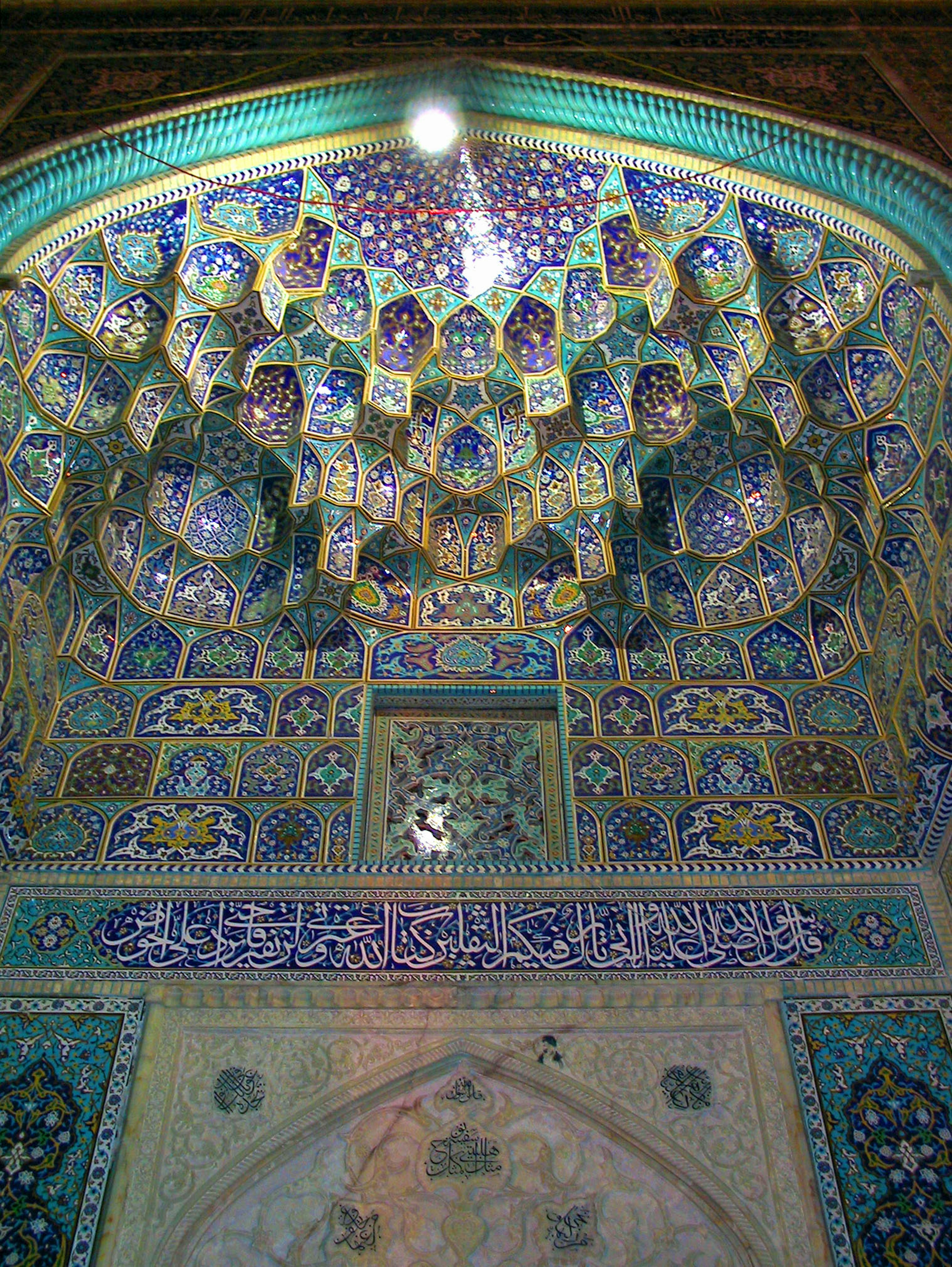 Intricate ceiling adorned with colorful tile decorations and geometric patterns