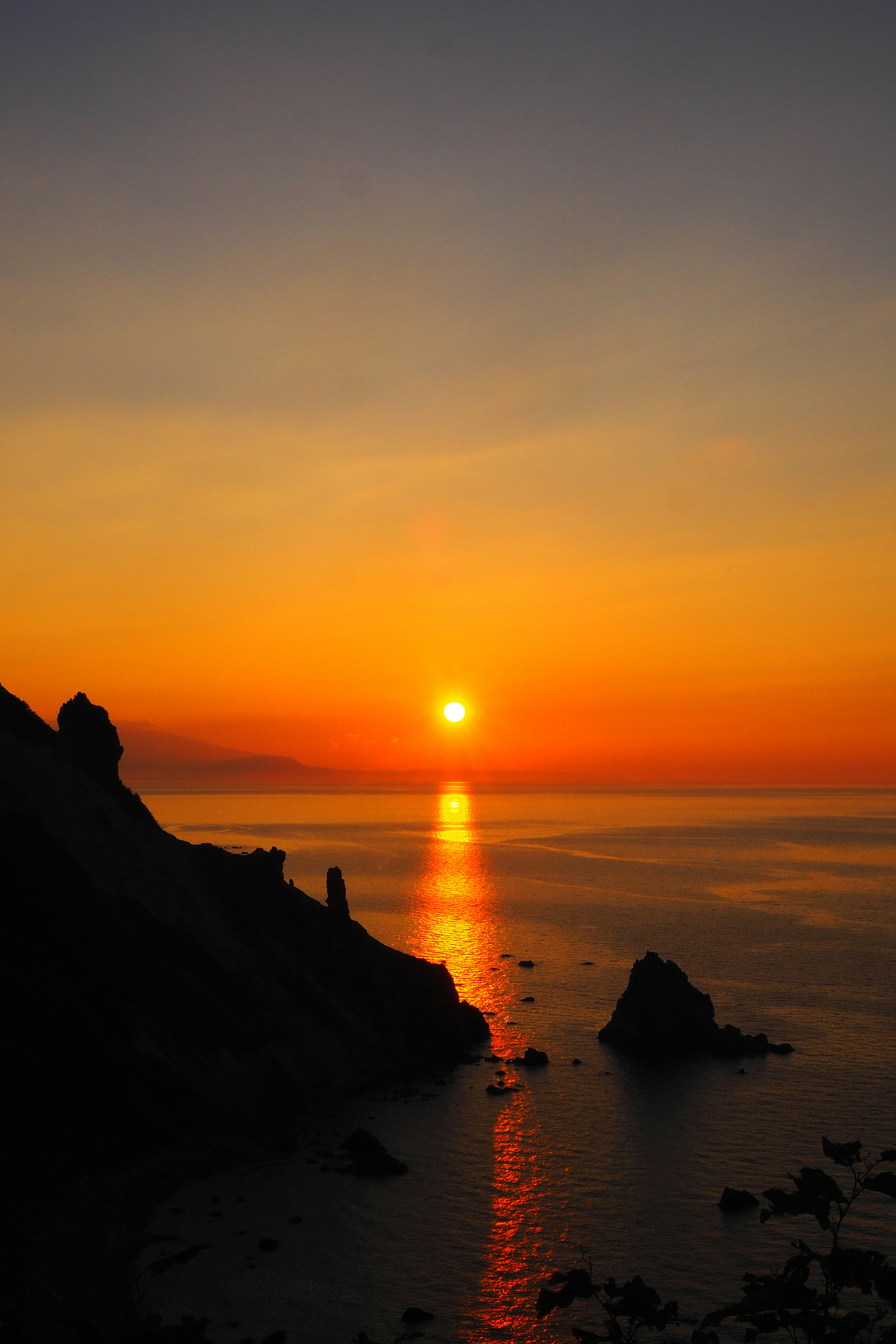 Stunning sunset over calm ocean water