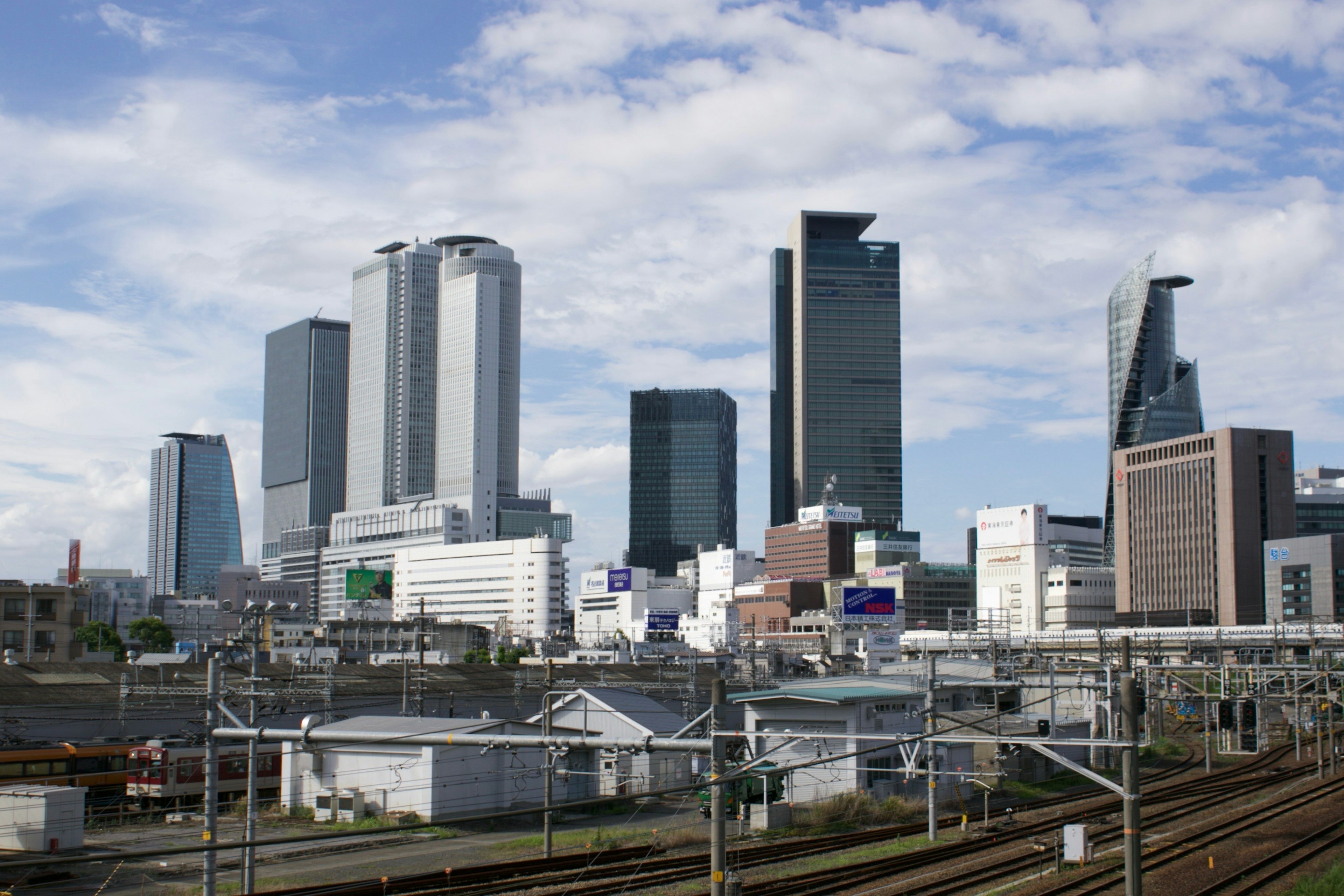 City skyline featuring modern skyscrapers and railway tracks