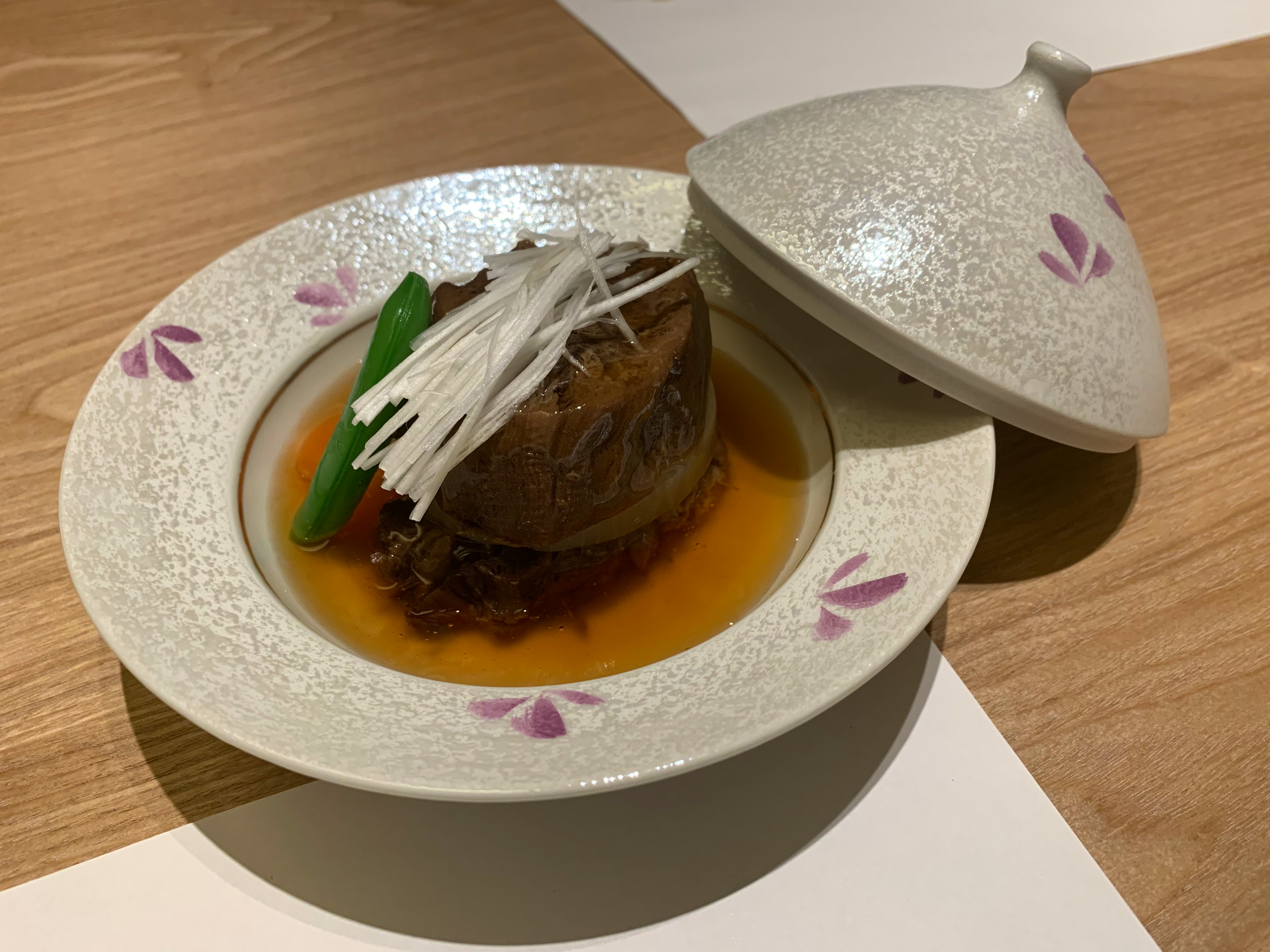 A beautifully plated dish served on a white plate