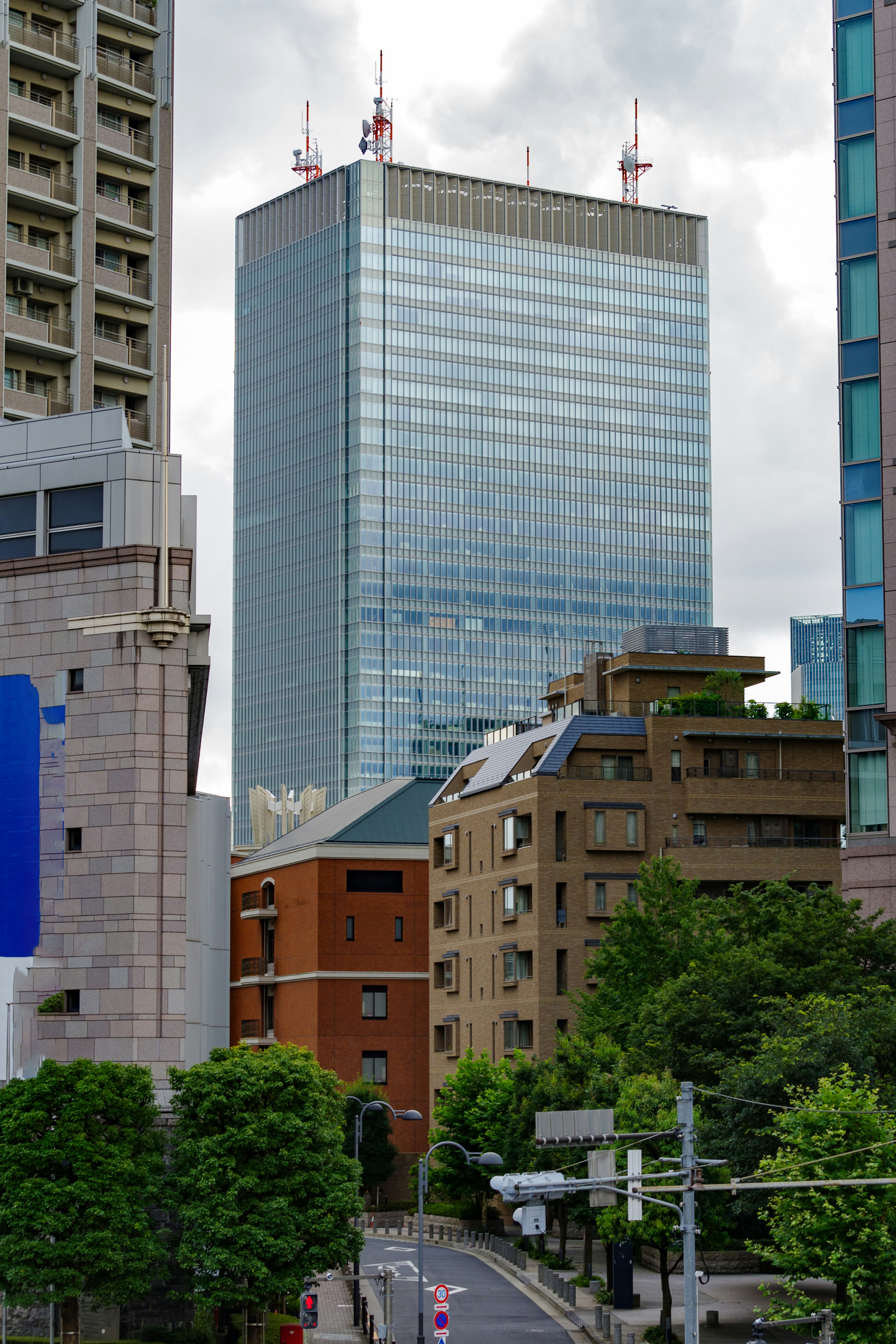 Urban landscape featuring tall buildings and lush greenery