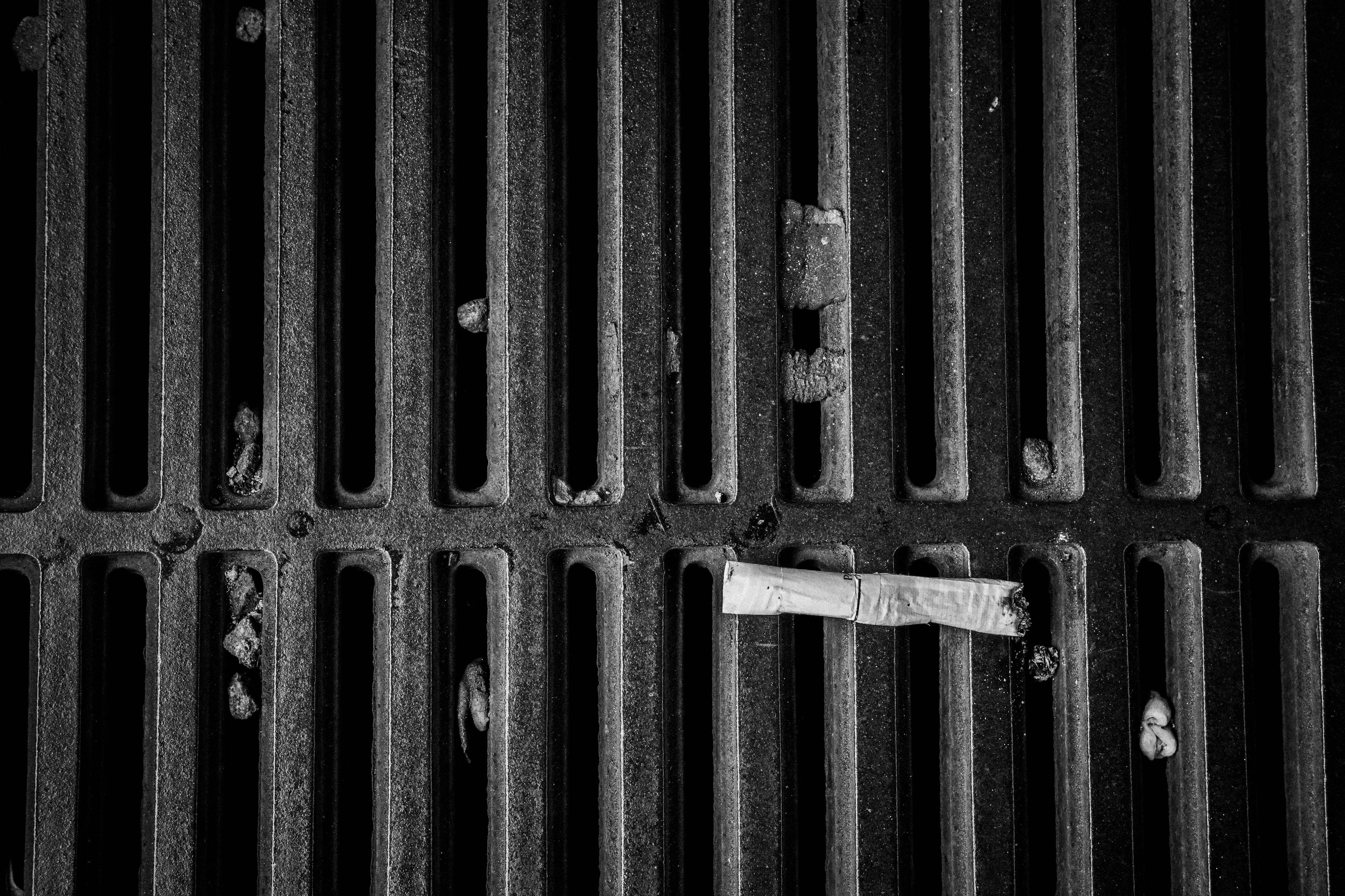 Concrete grate with a piece of white paper on it