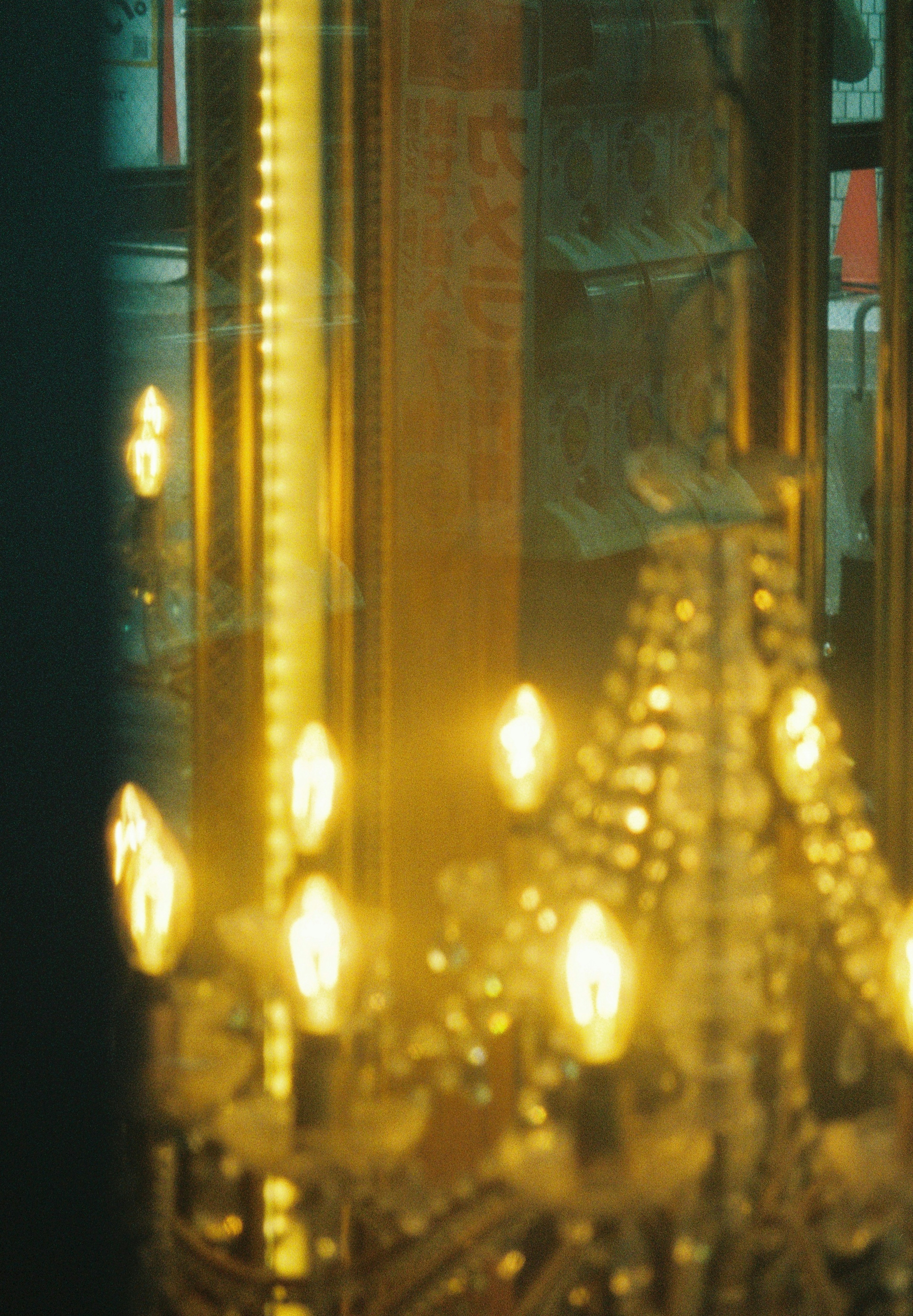 Glimmering chandelier with golden light reflections