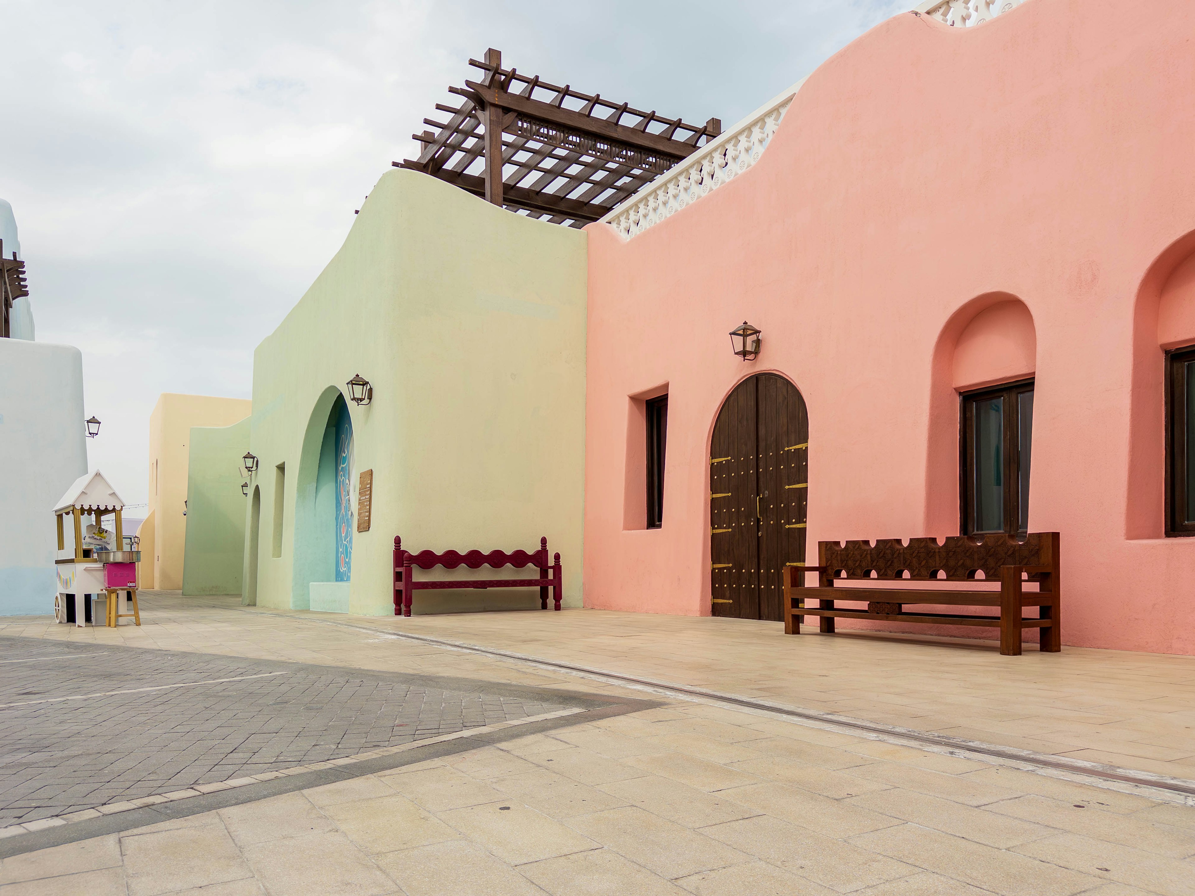 Colorful buildings and benches in a quiet street