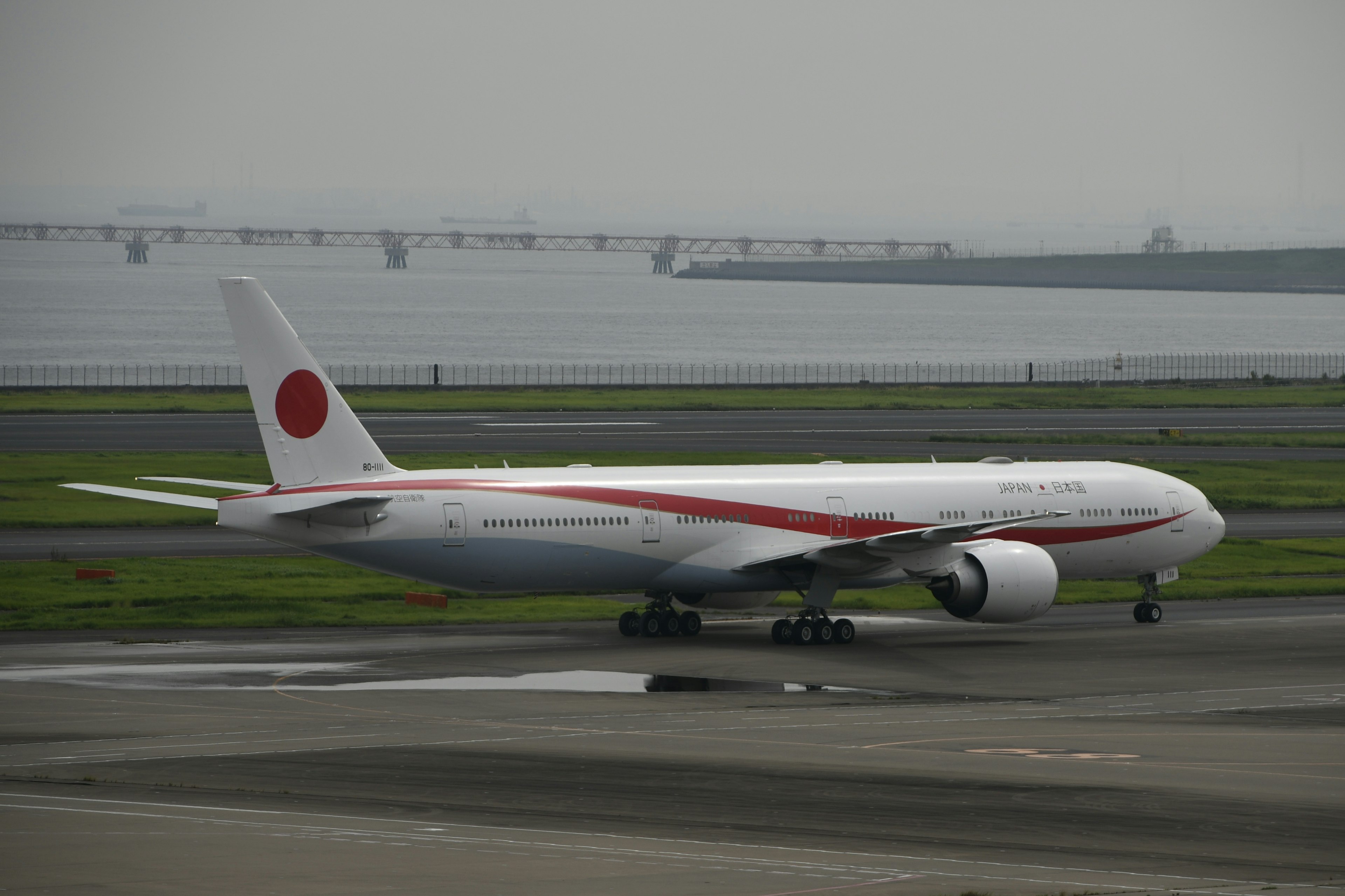 Boeing 777 of Japanese airline taxiing on runway