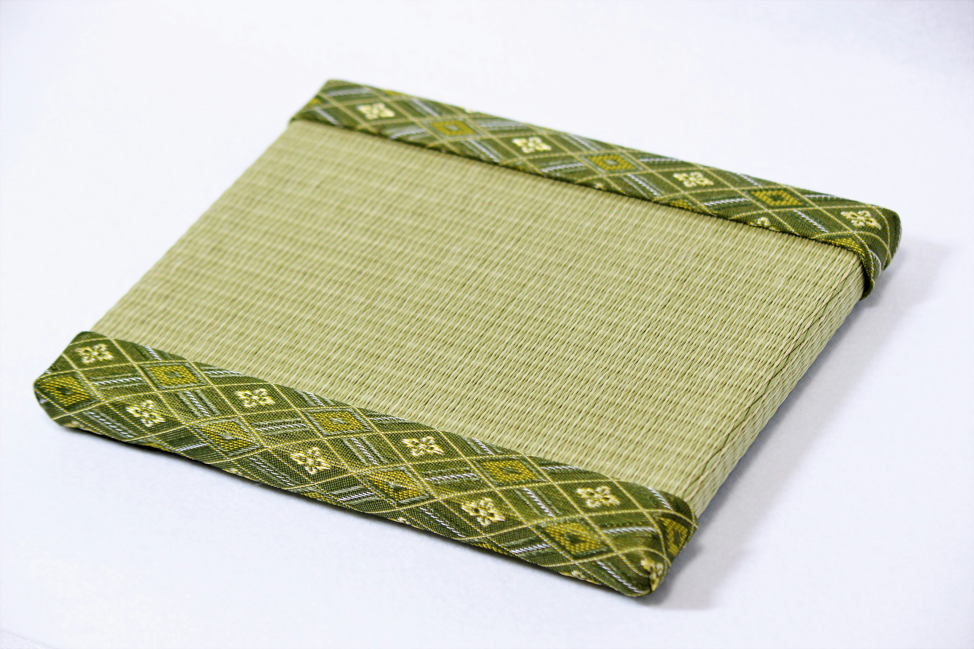 Traditional Japanese cushion with green decorative trim