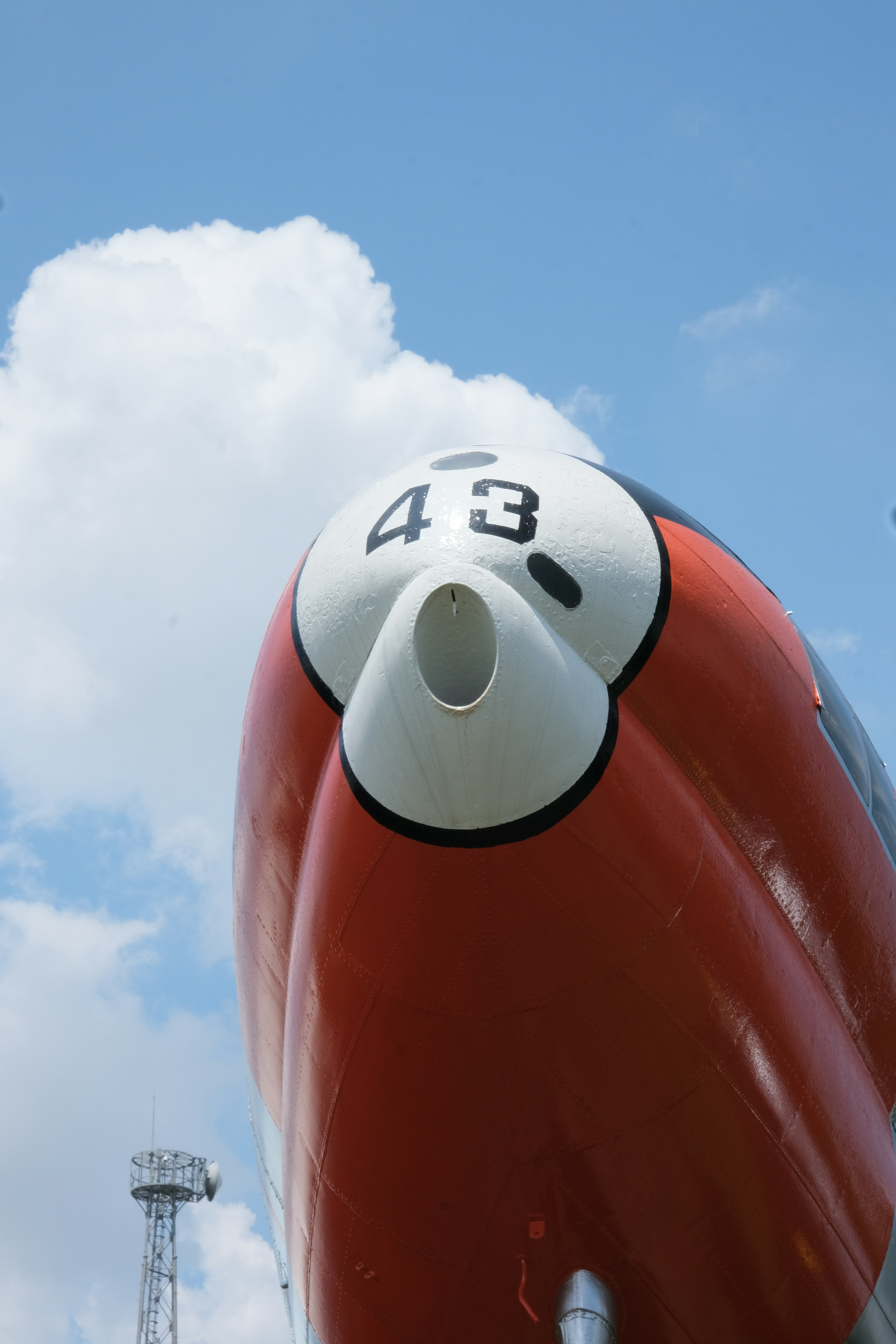 Close-up of an aircraft nose with red and white design featuring number 43