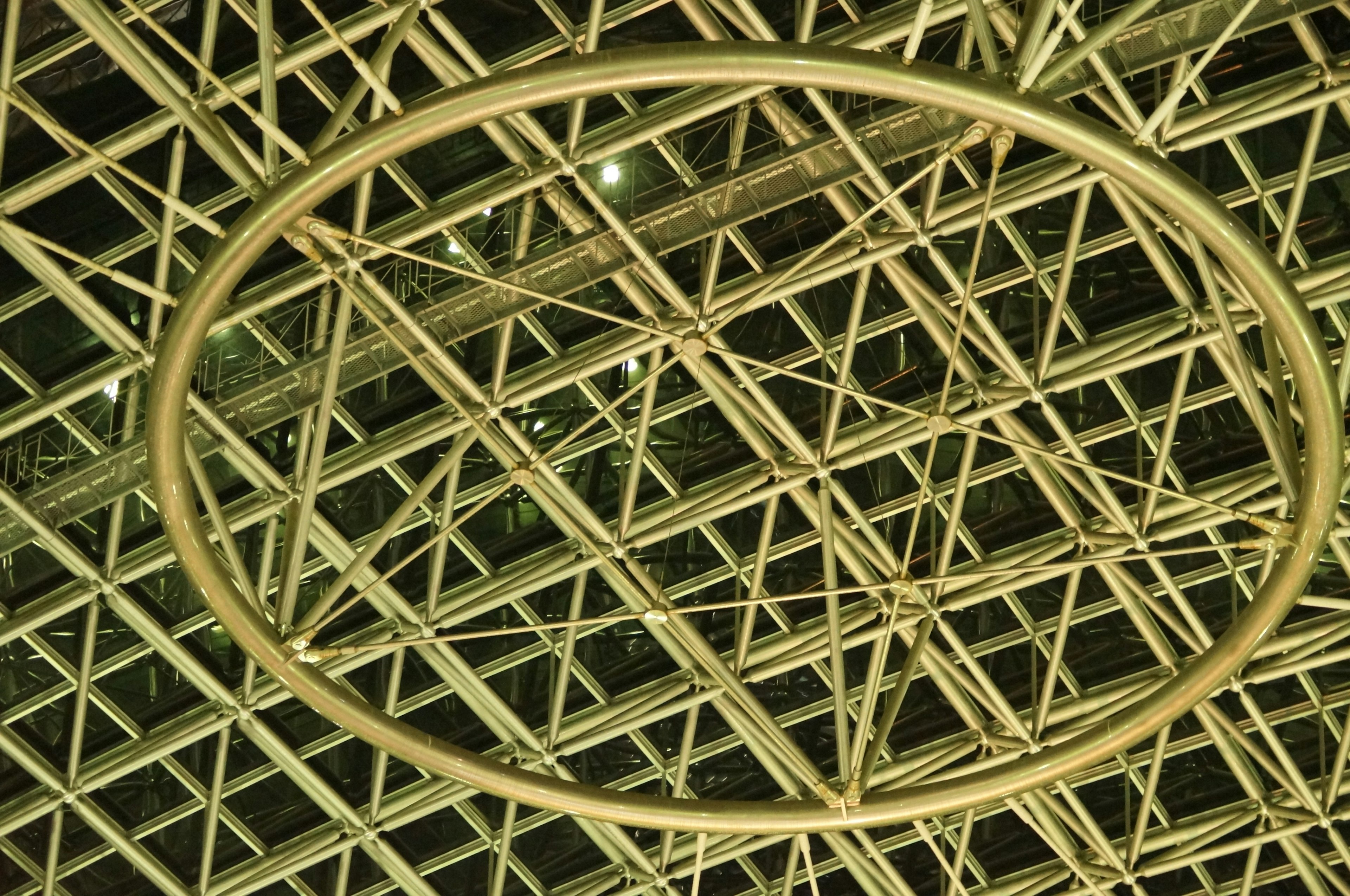 Ceiling design featuring a metal framework and circular frame