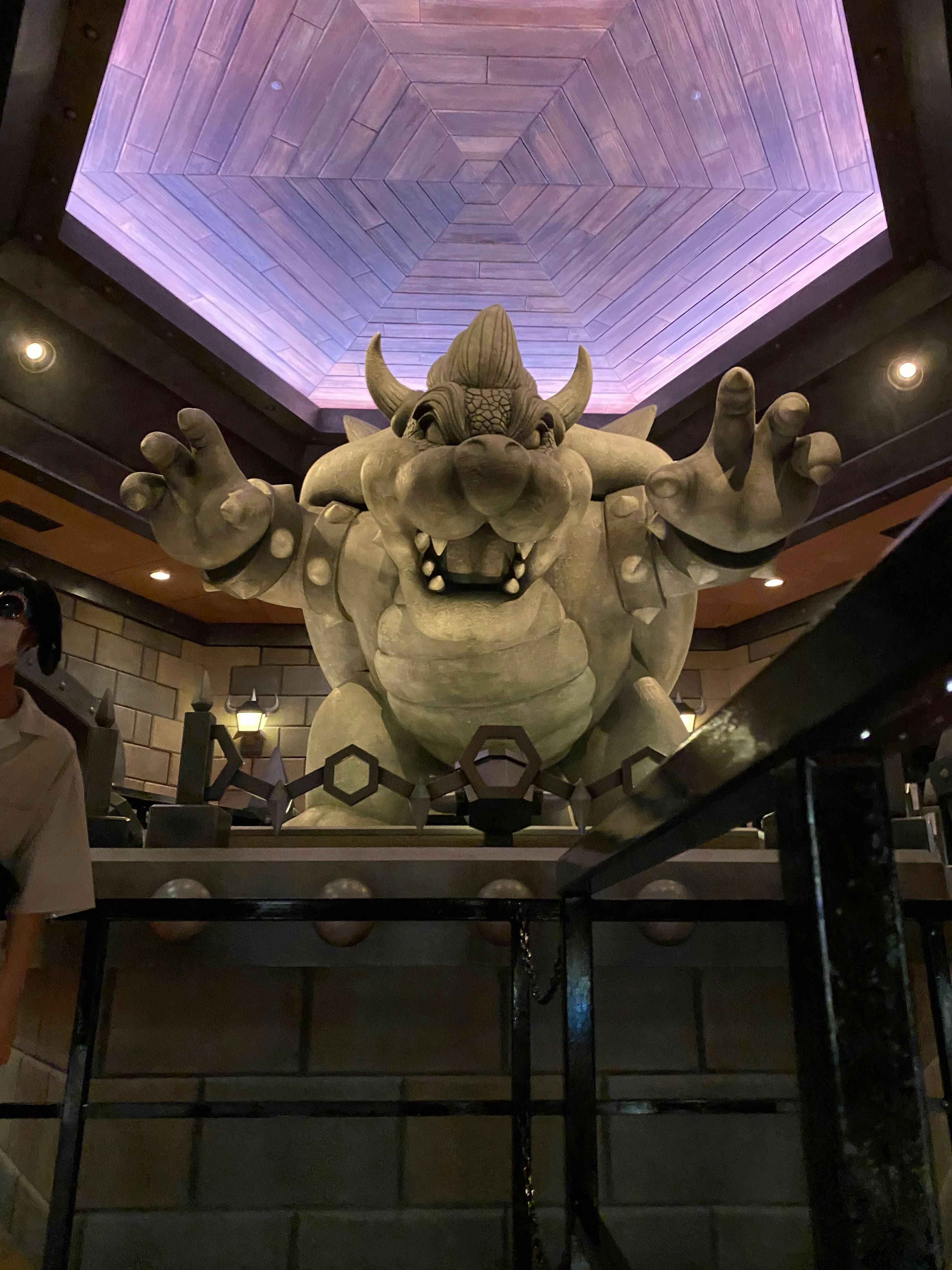 Large monster sculpture in a theme park interior