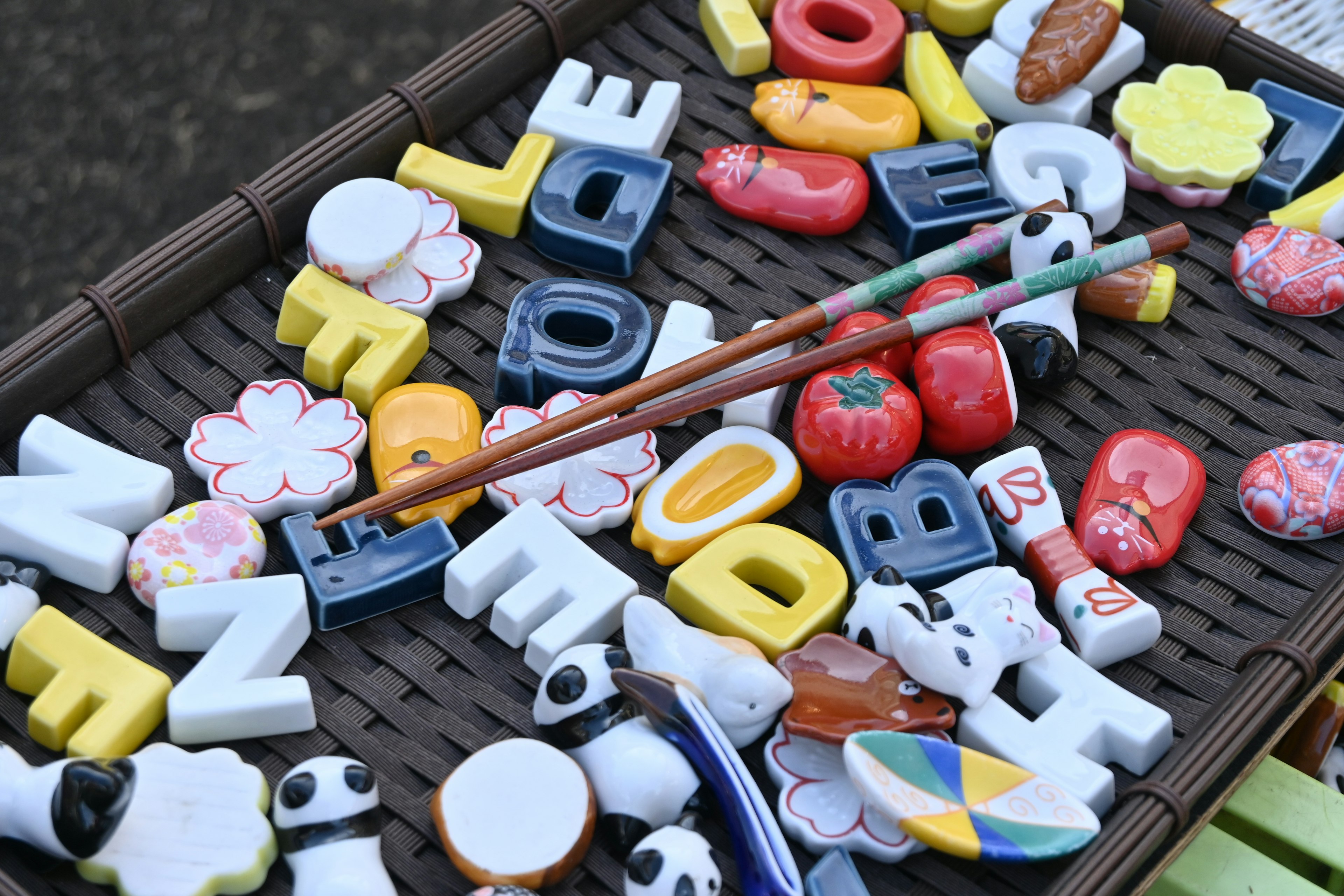 Colorful assortment of alphabet and shape magnets on a tray