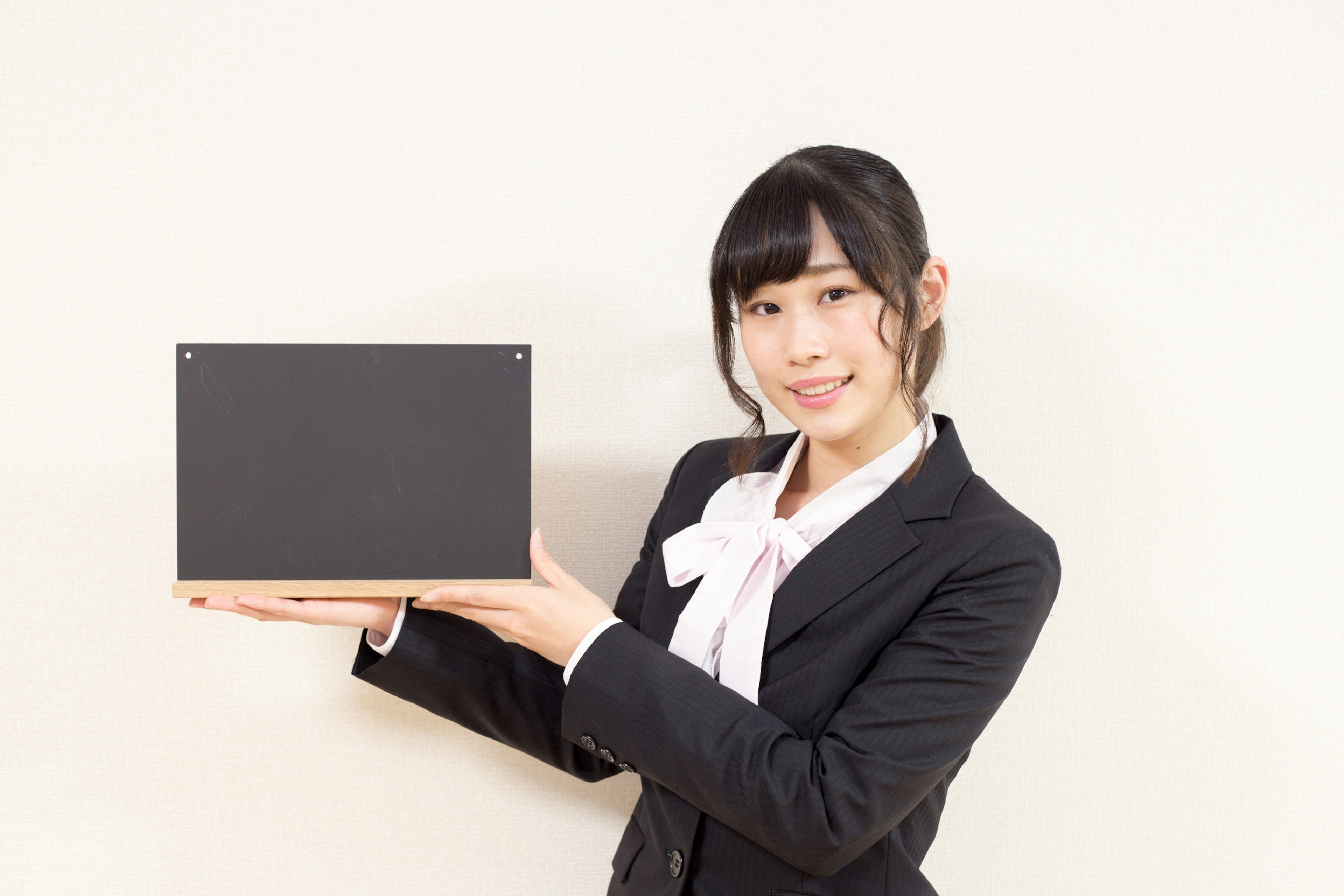 Businesswoman holding a black box