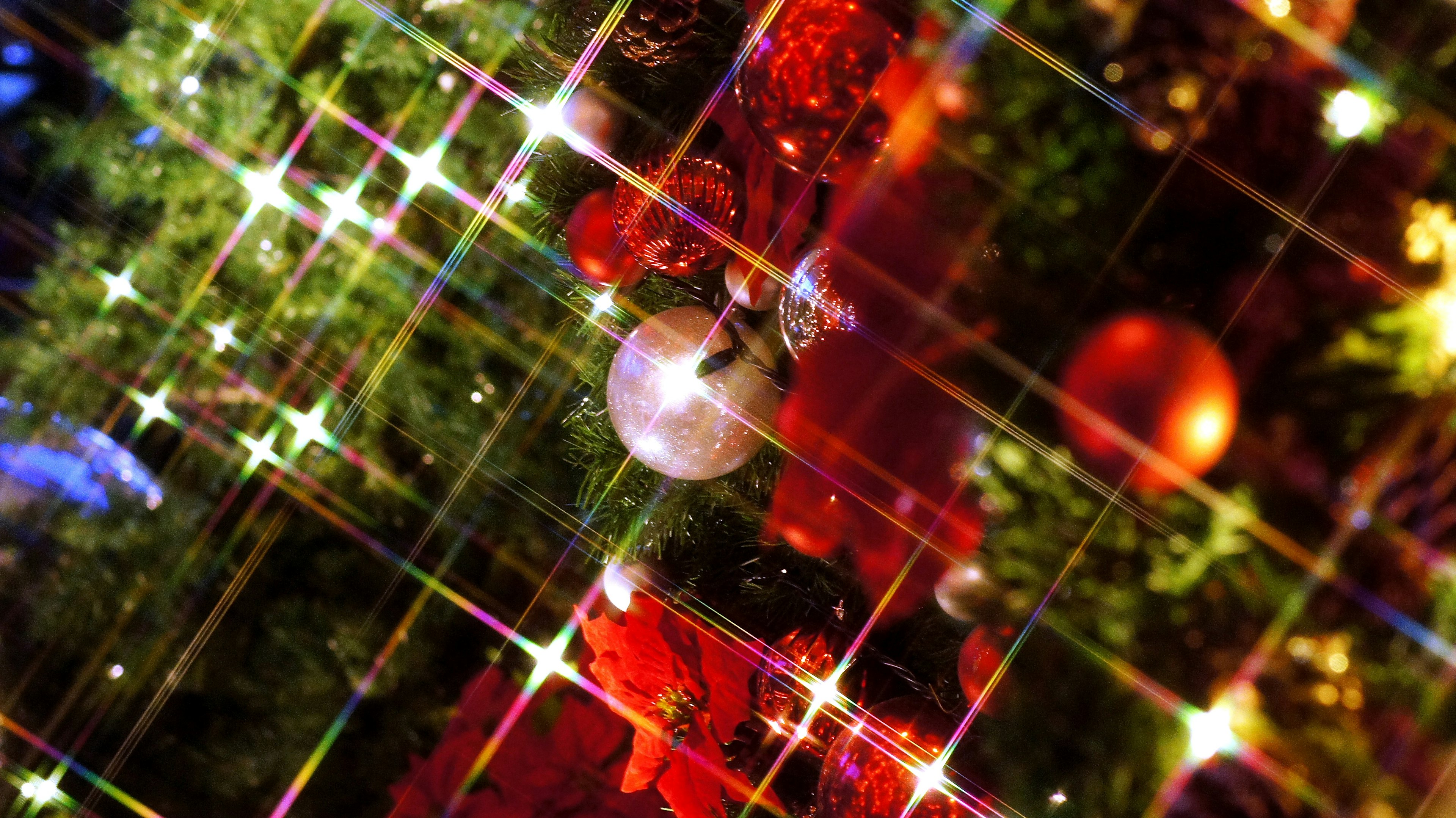 Close-up of decorated Christmas tree with sparkling ornaments