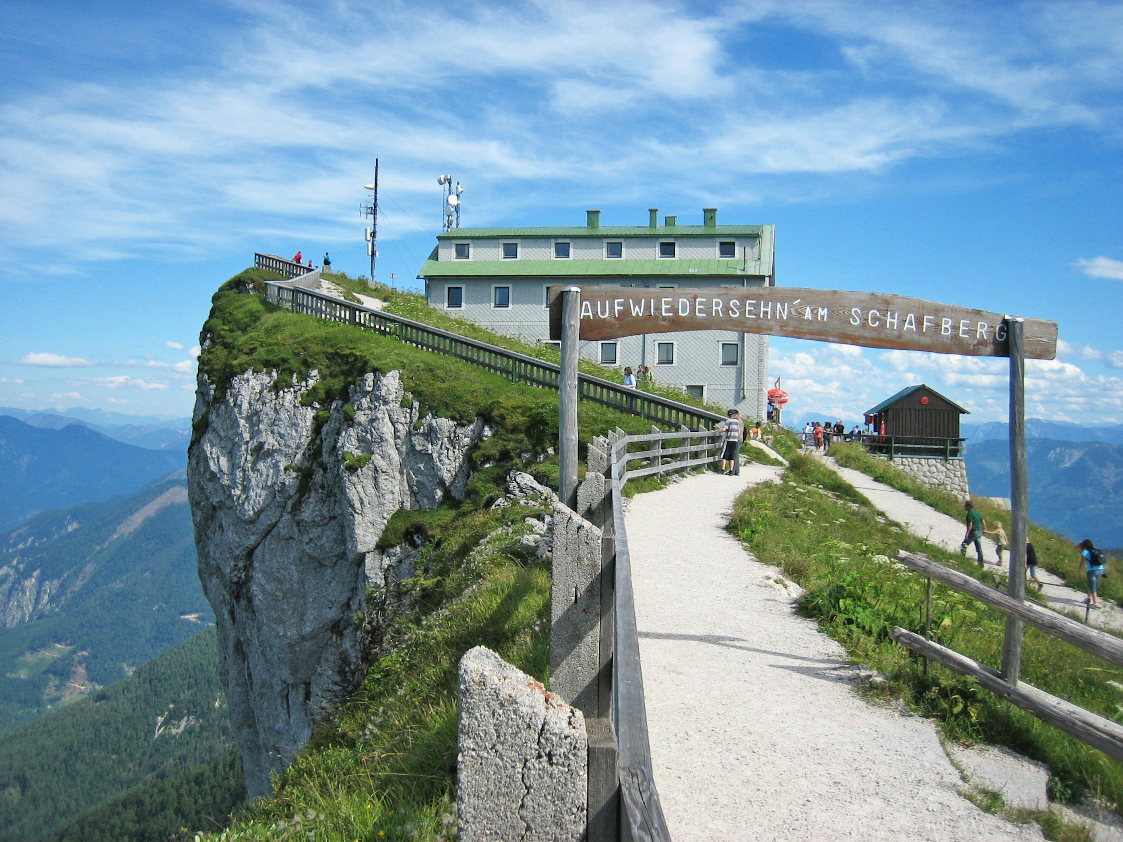 Mountain lodge surrounded by lush greenery and scenic views