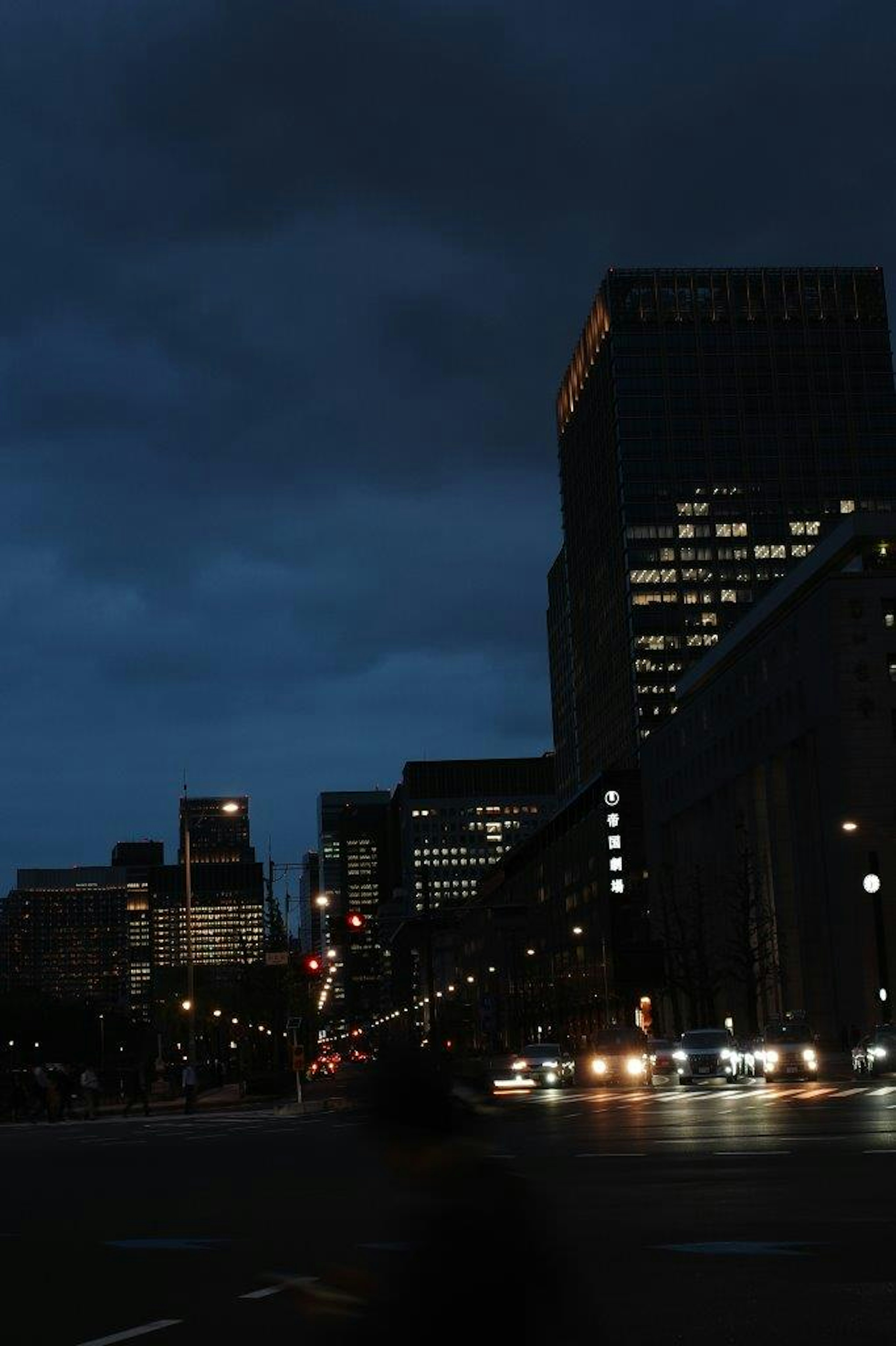 Nighttime cityscape with buildings and streetlights