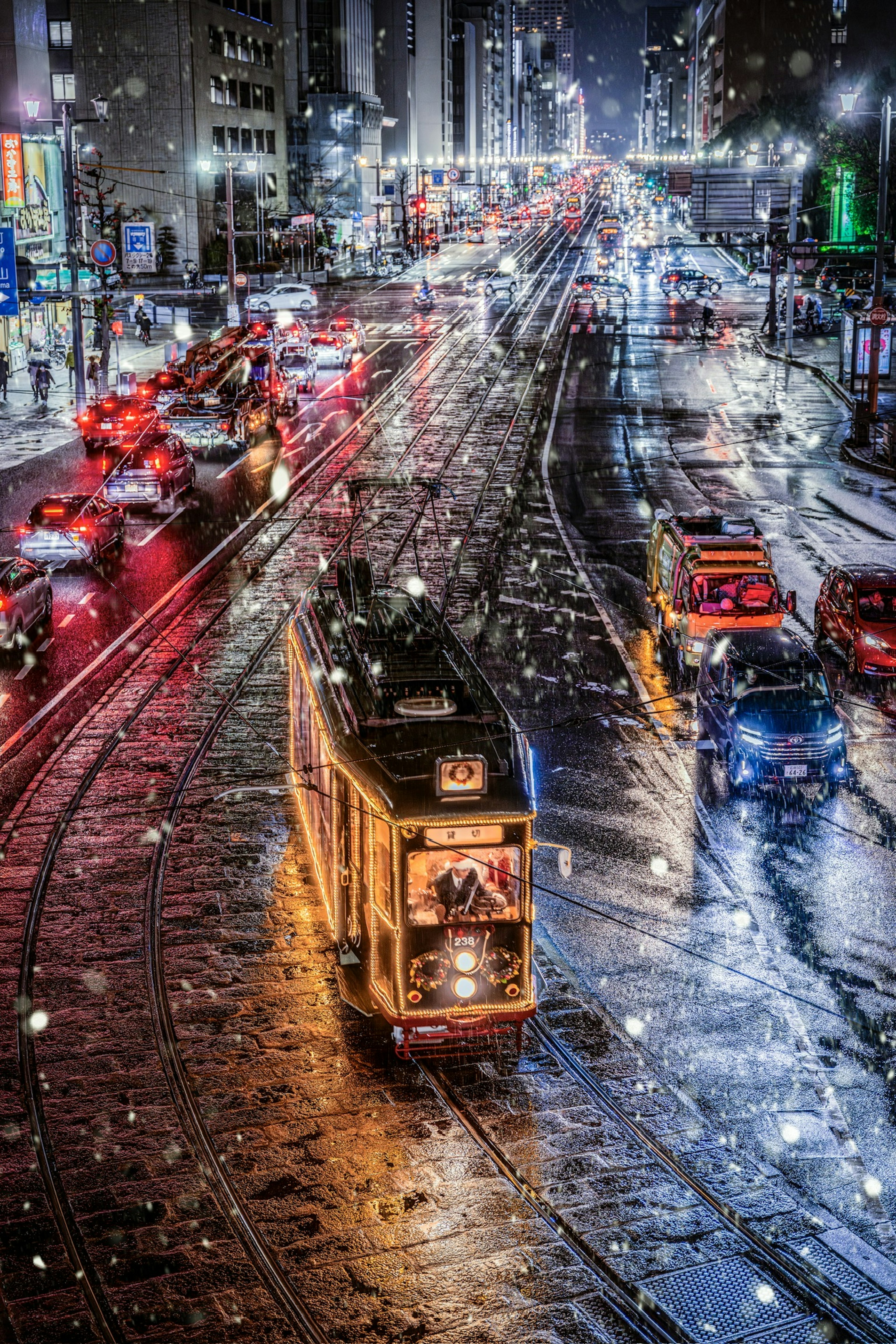 Snowy night cityscape with a tram and colorful traffic