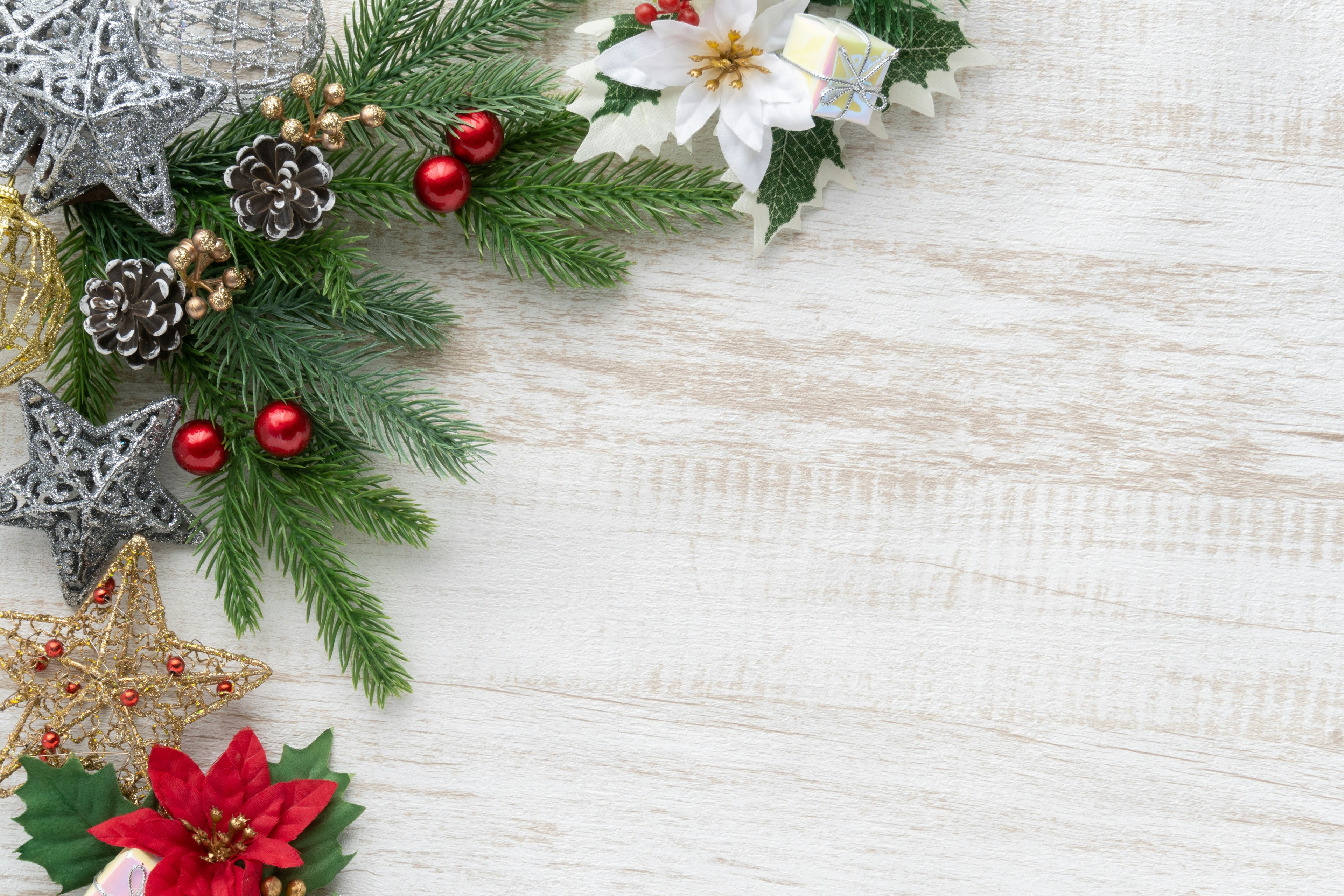 Beautiful arrangement of Christmas decorations and pine leaves