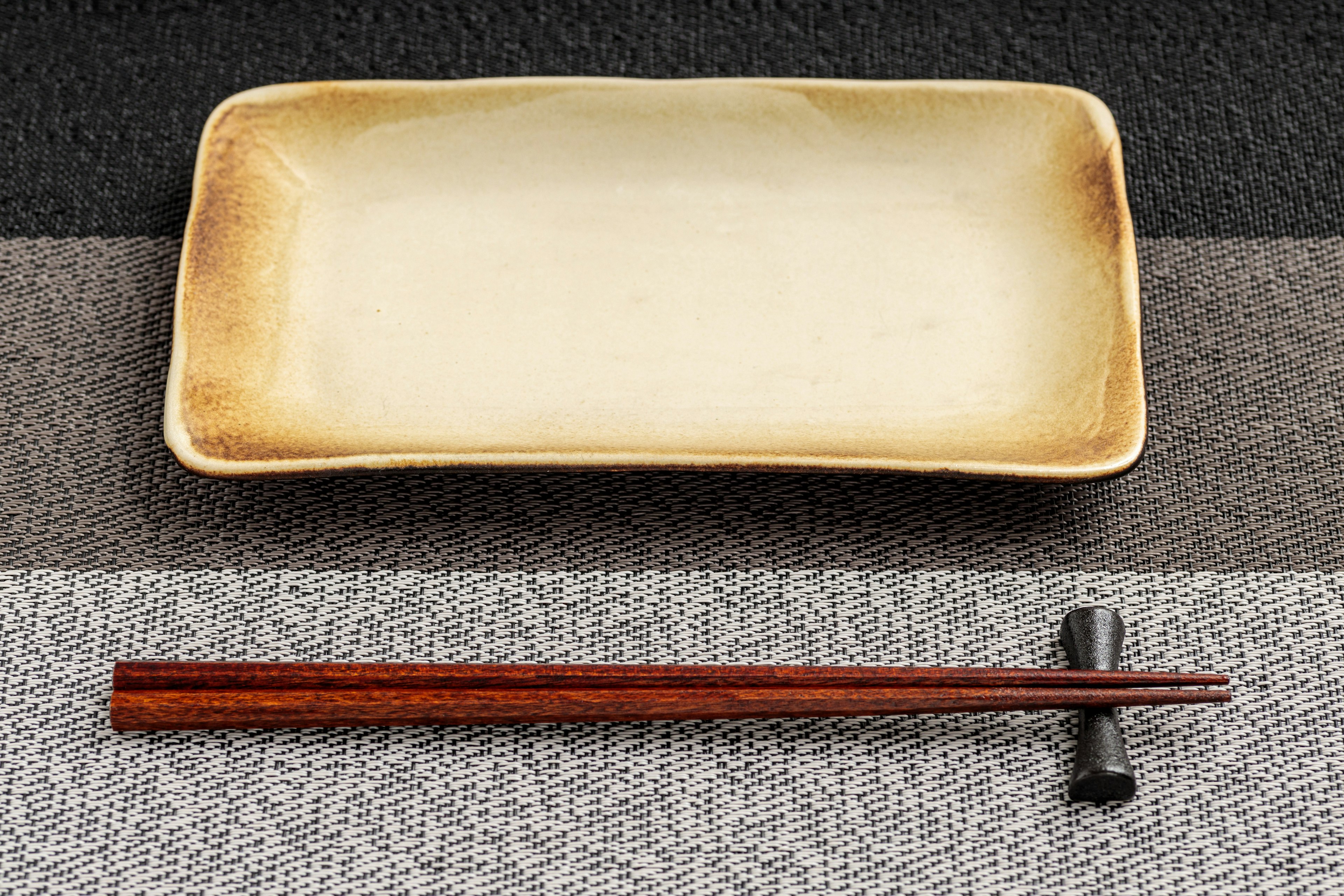 Simple table setting with a plate and chopsticks