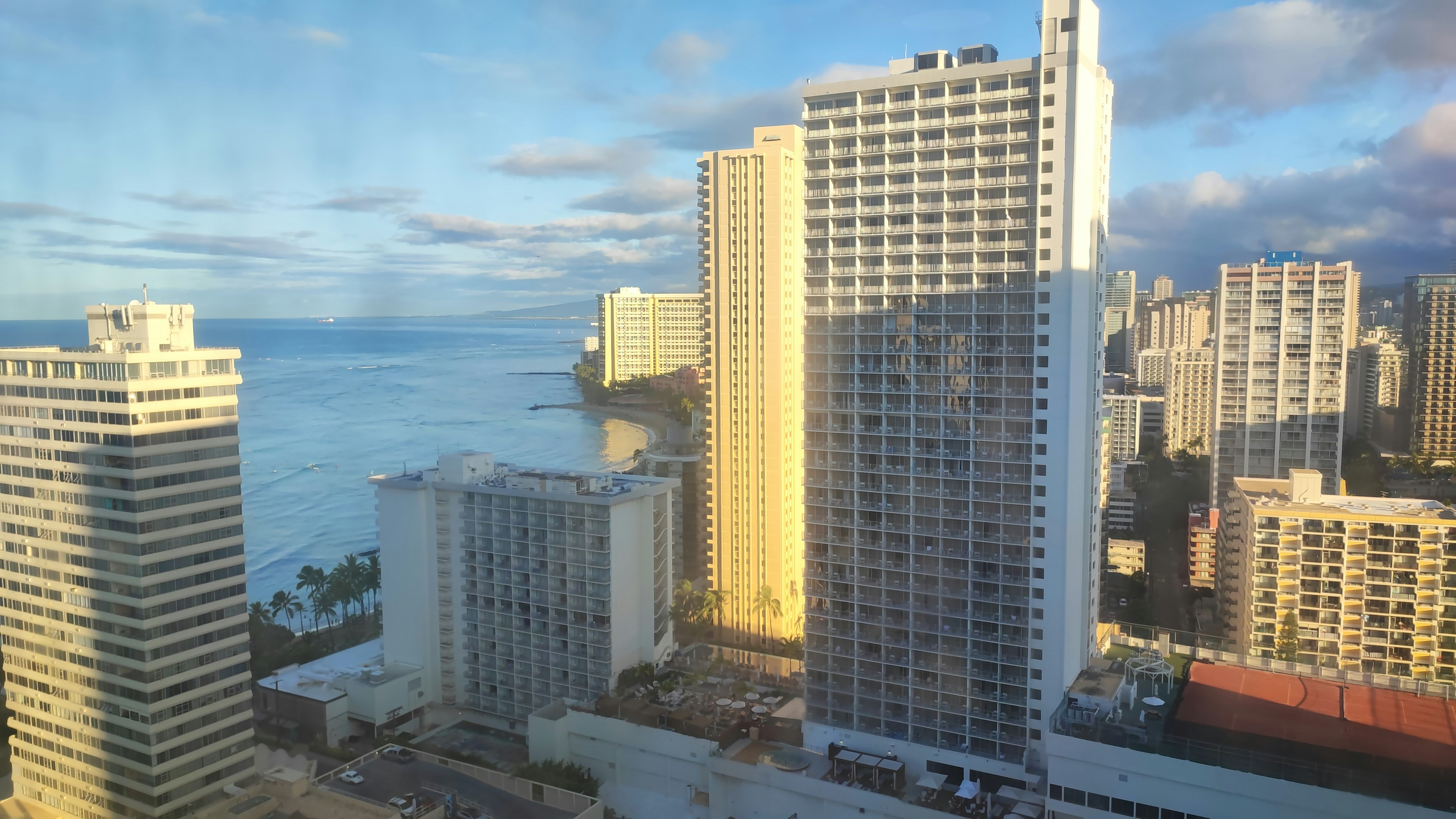 Cityscape of Hawaii featuring high-rise buildings and ocean view