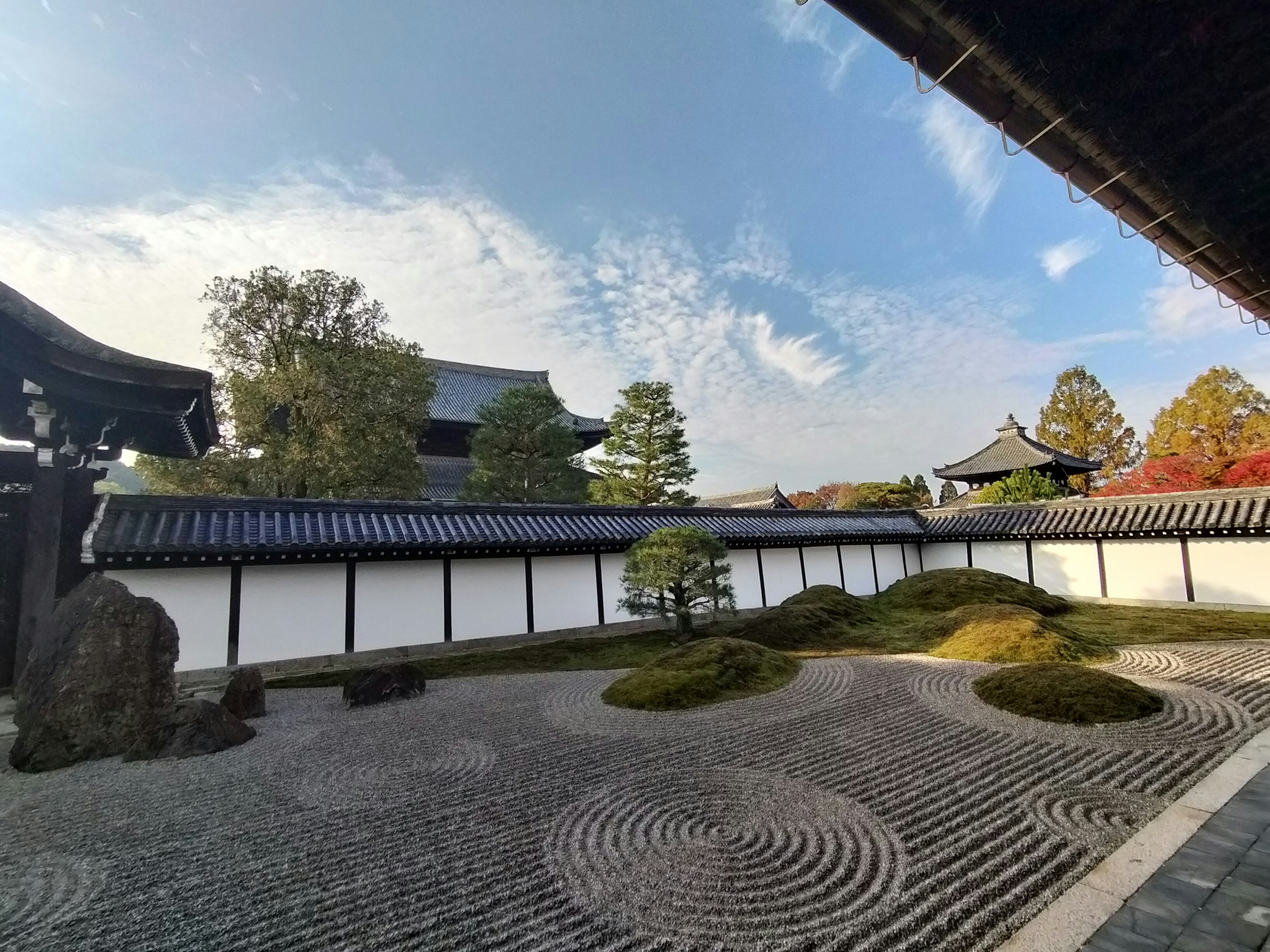 A serene garden view showcasing traditional Japanese architecture