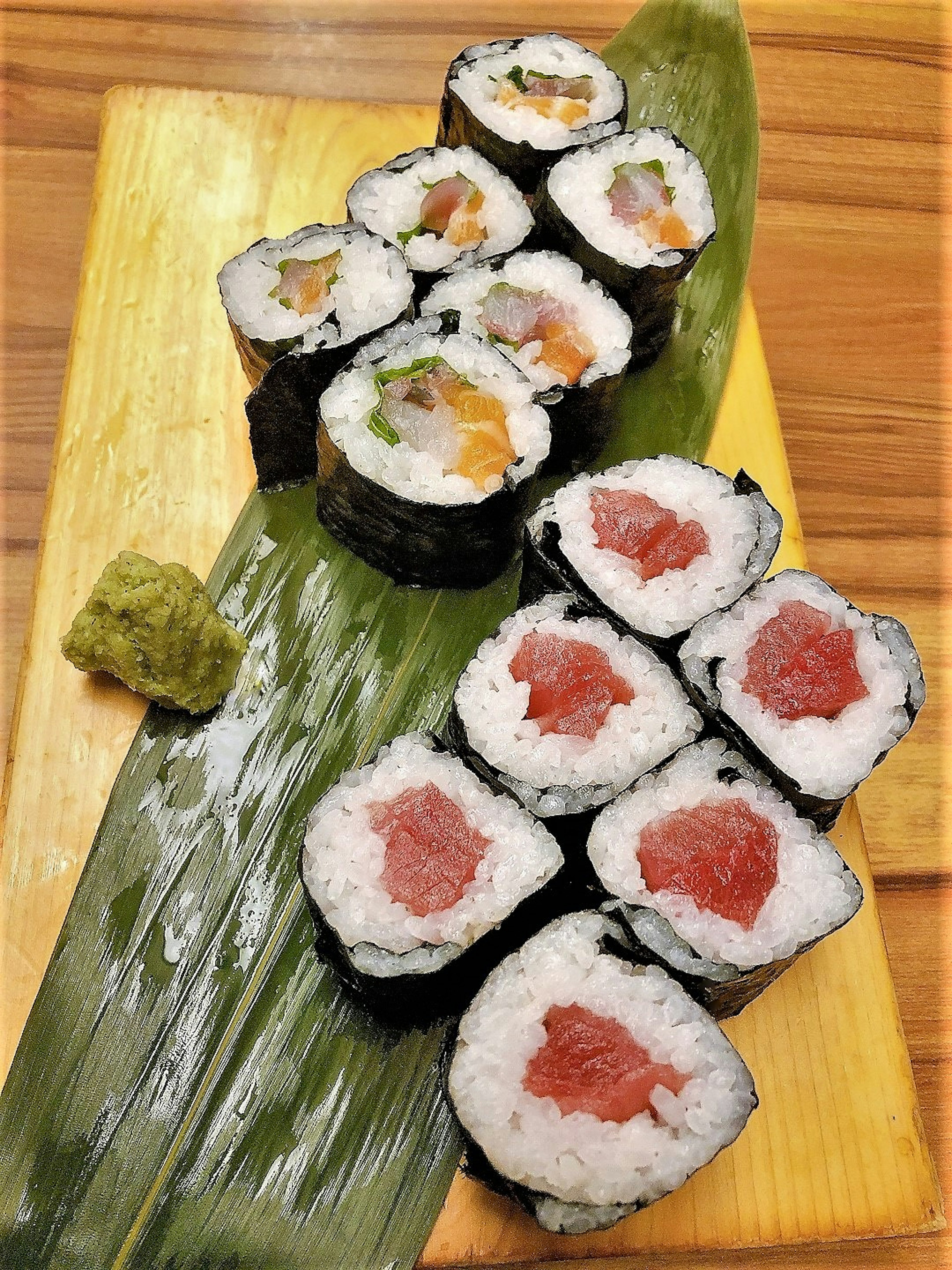 A fresh sushi platter displayed on a wooden board