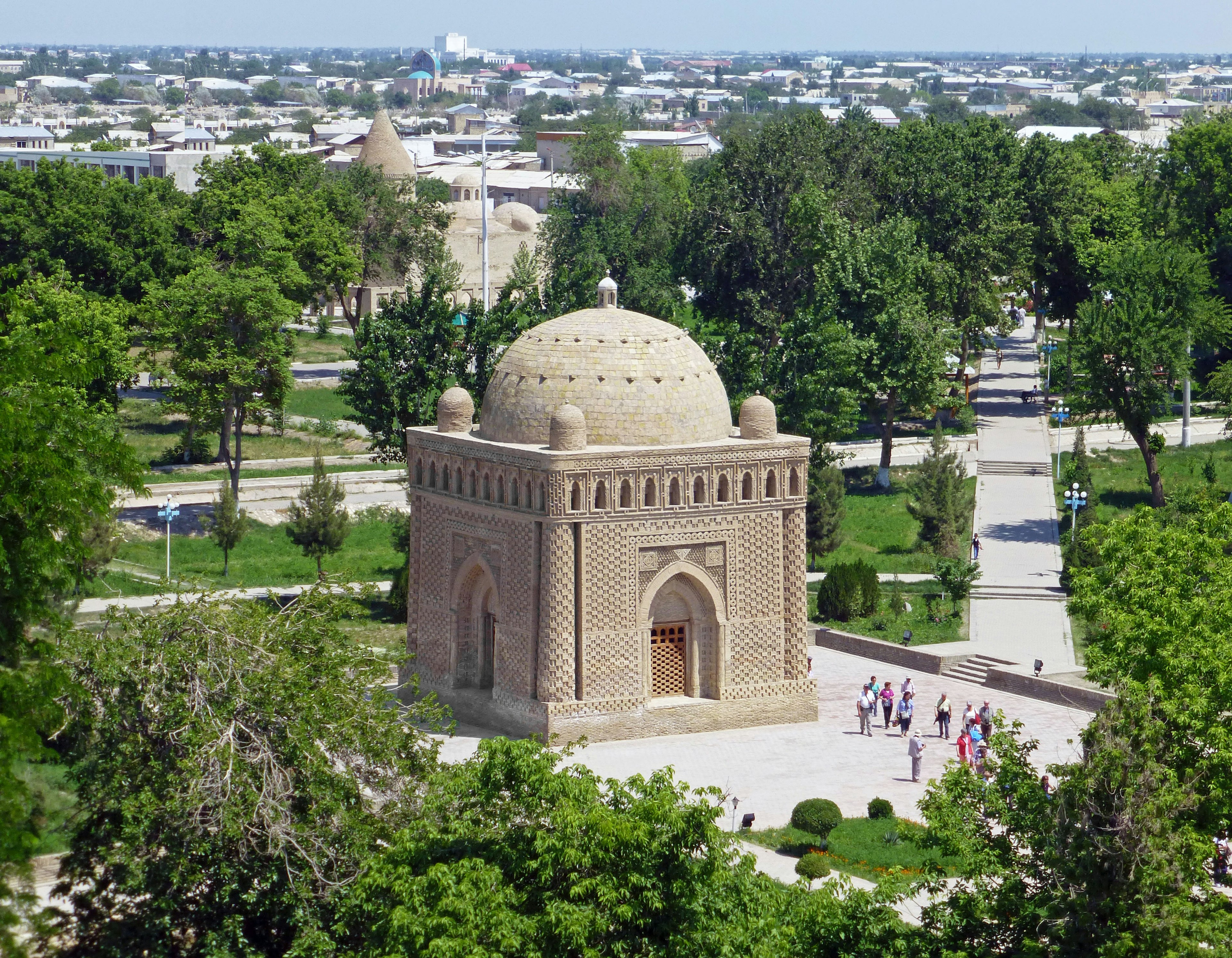 Dome-shaped building surrounded by a beautiful park and lush greenery