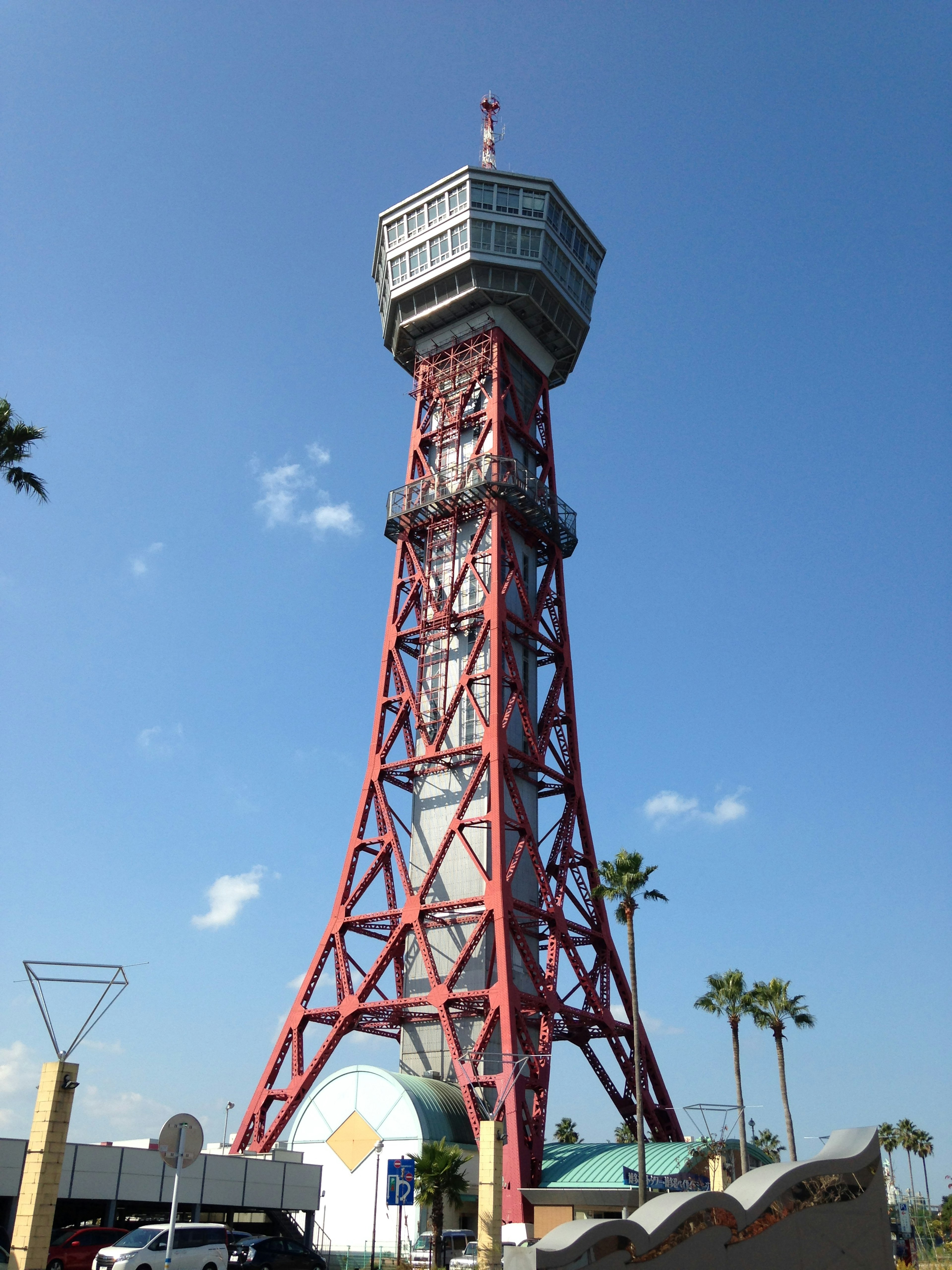 Red observation tower against a blue sky