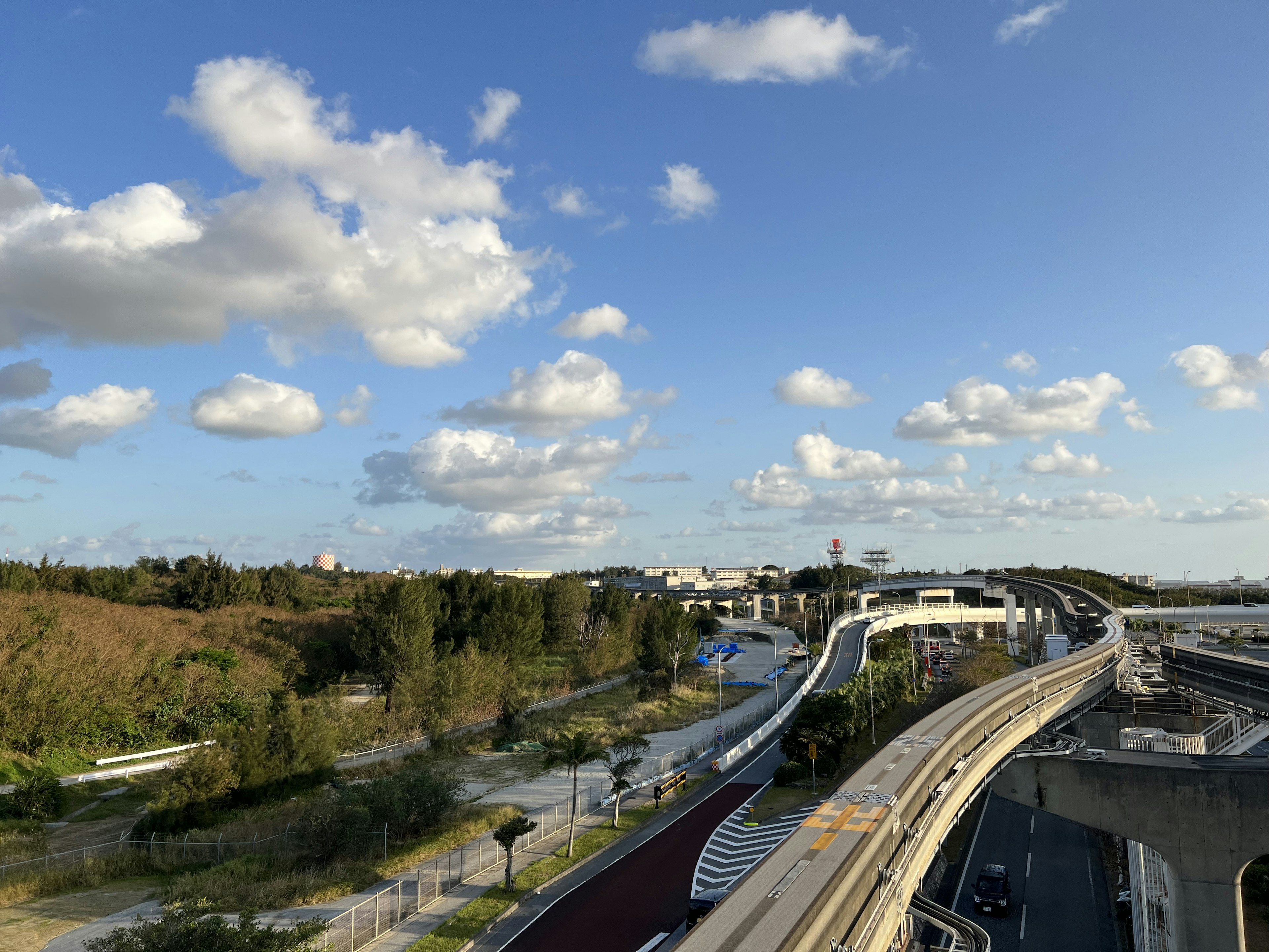 Scenic view of a blue sky with clouds highways and greenery