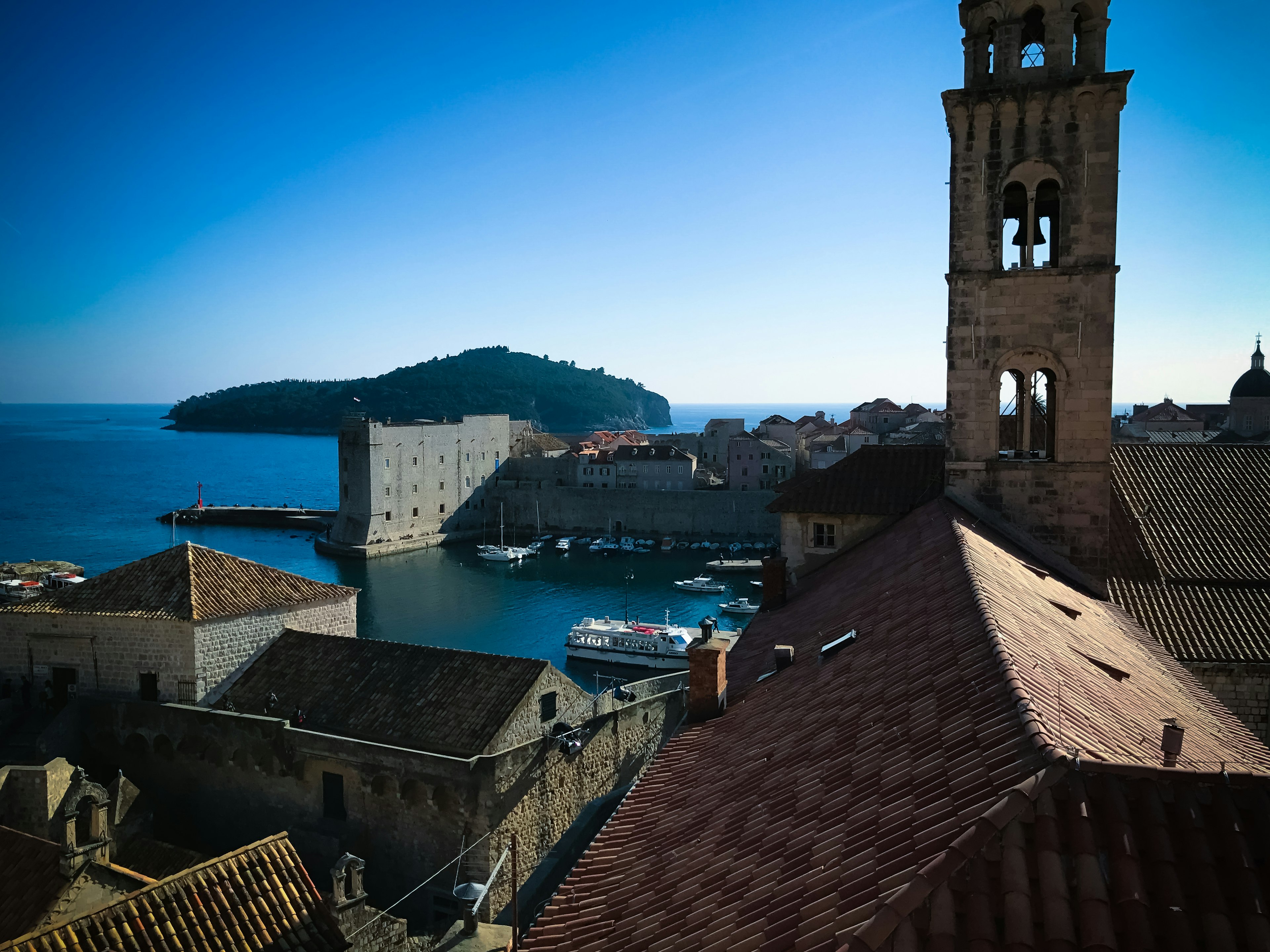 Scenic view of Dubrovnik featuring historic buildings and a tranquil sea