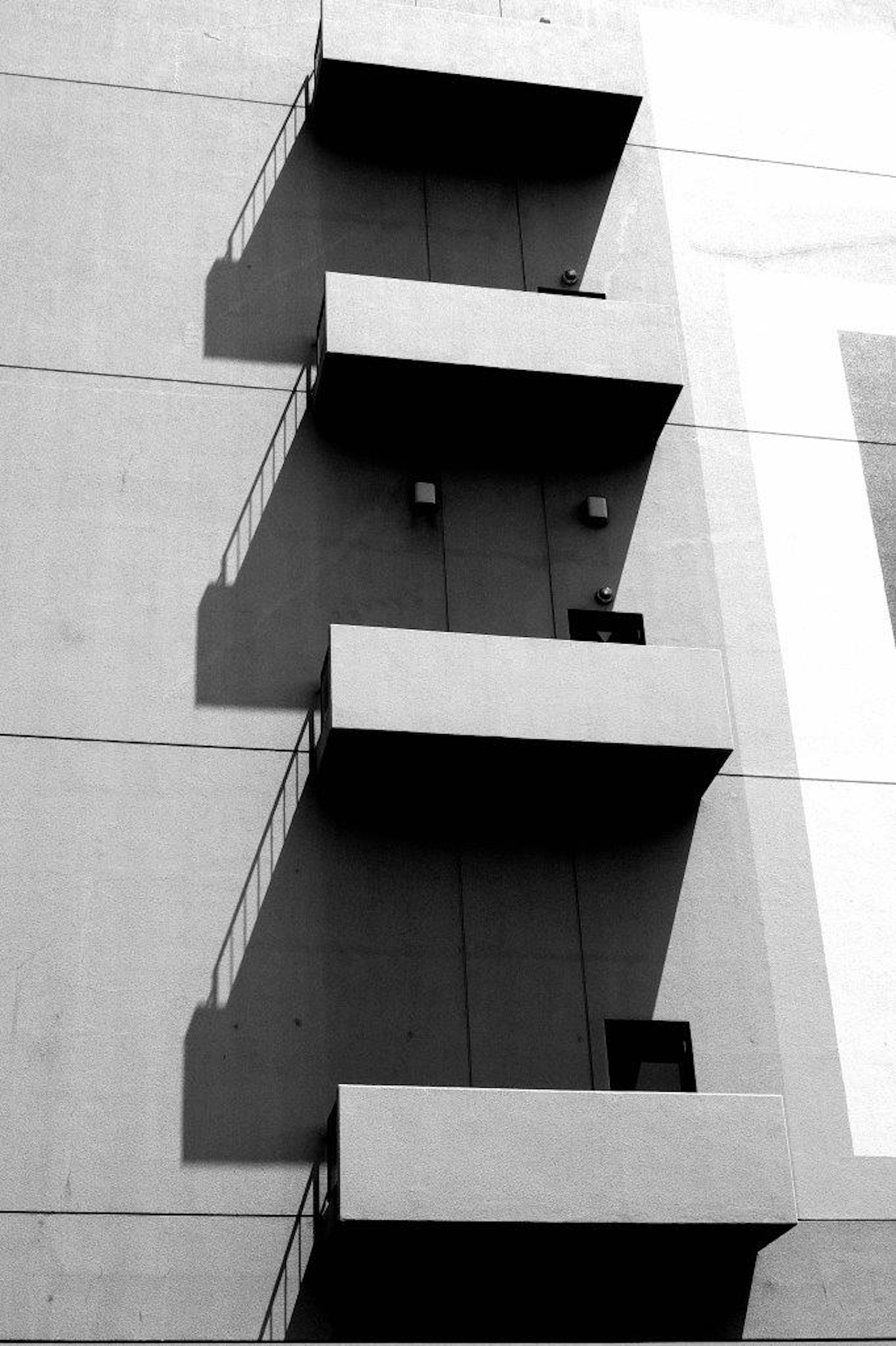 Exterior of a building featuring staggered balconies