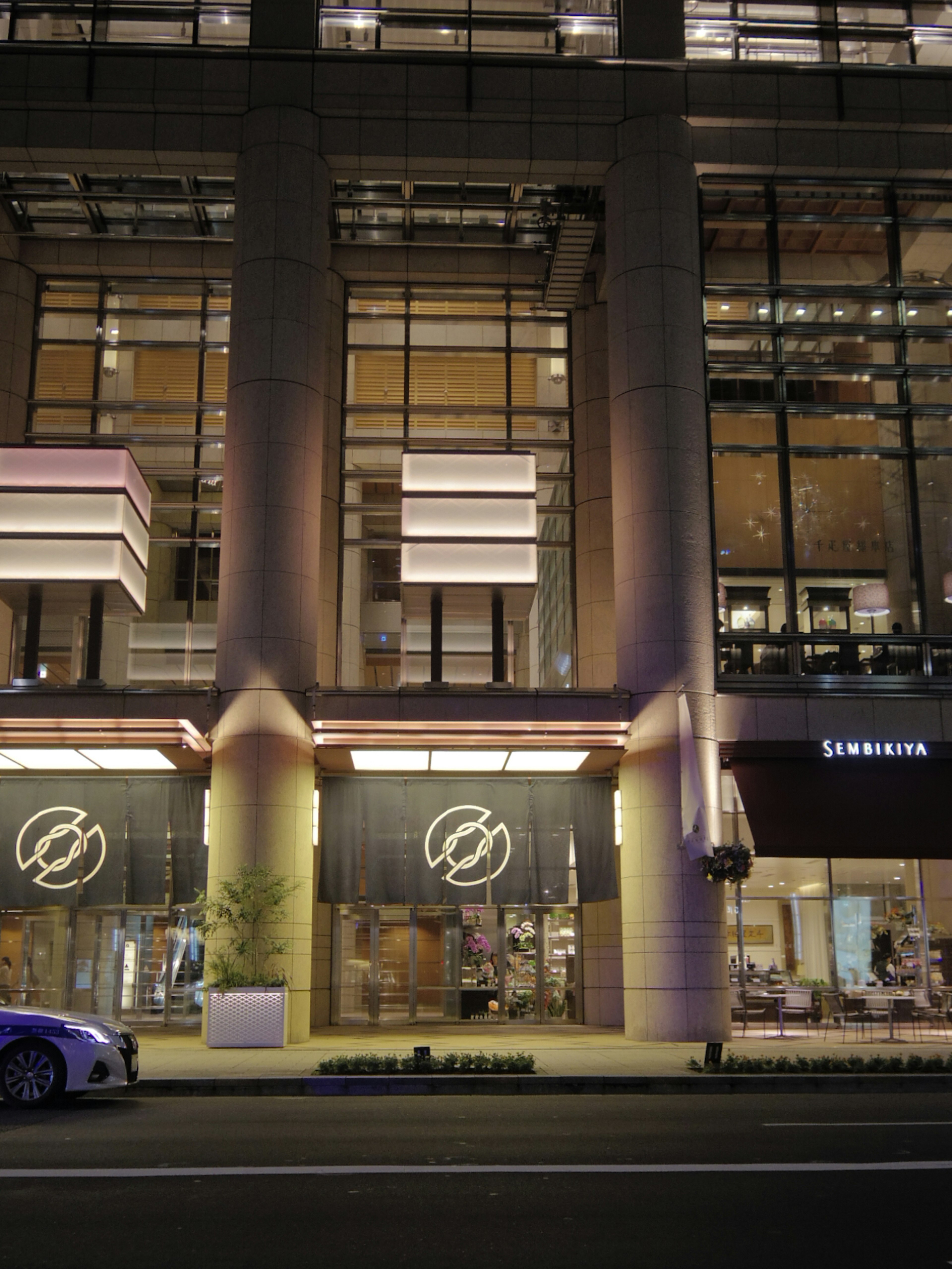 Starbucks storefront with modern architectural design at night