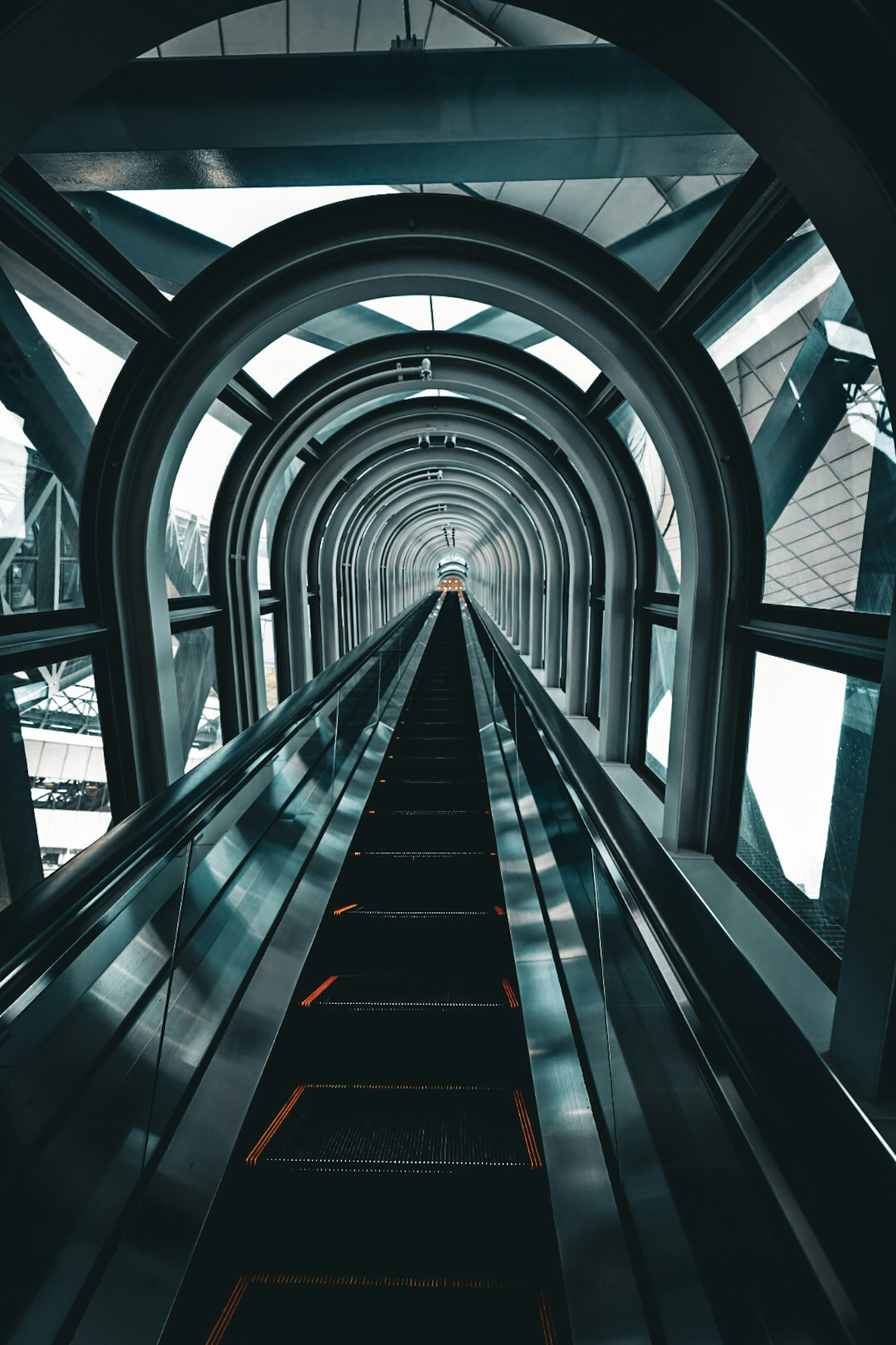 Futuristic escalator tunnel with sleek architecture