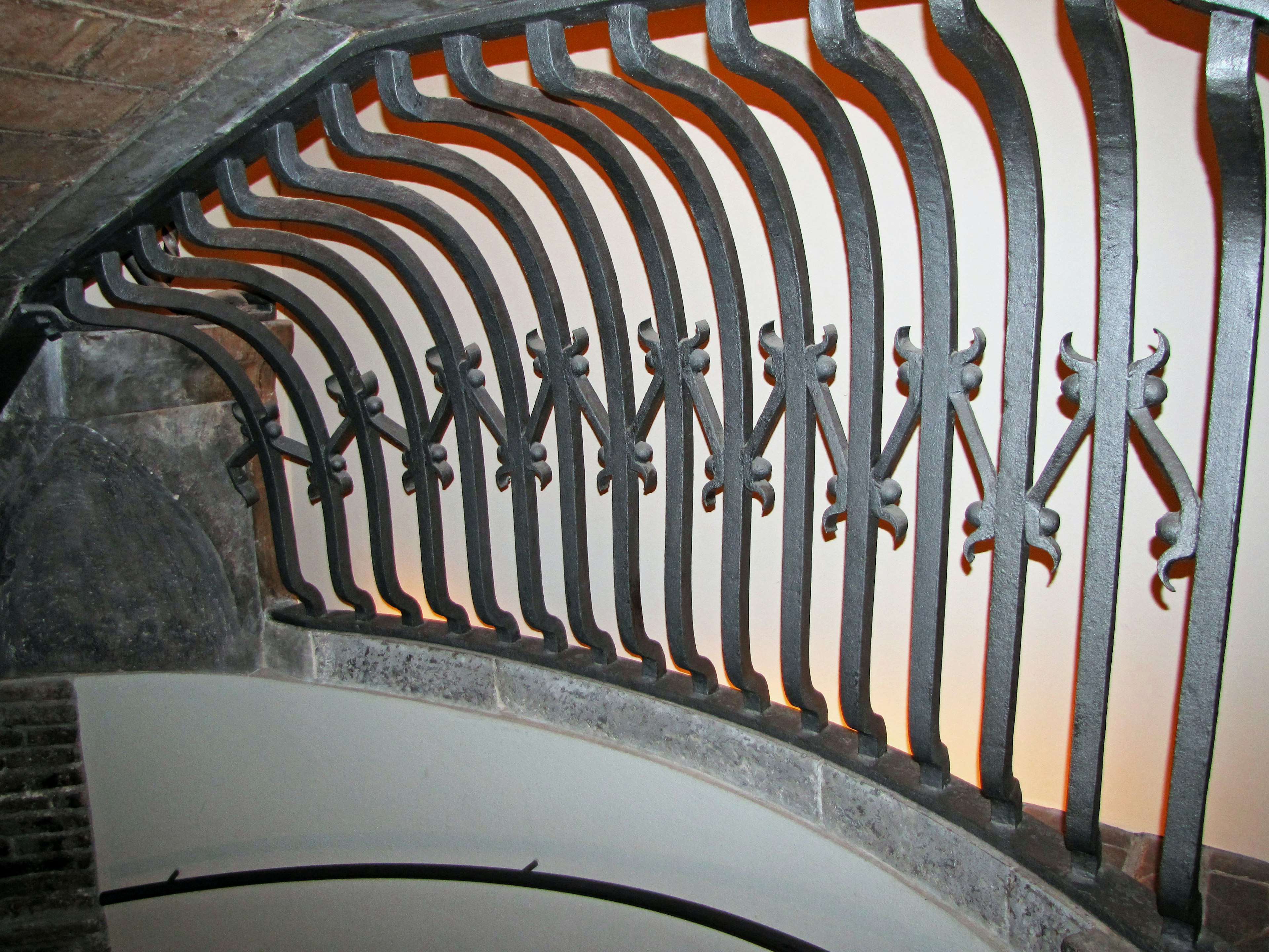 Curved iron railing design of a spiral staircase