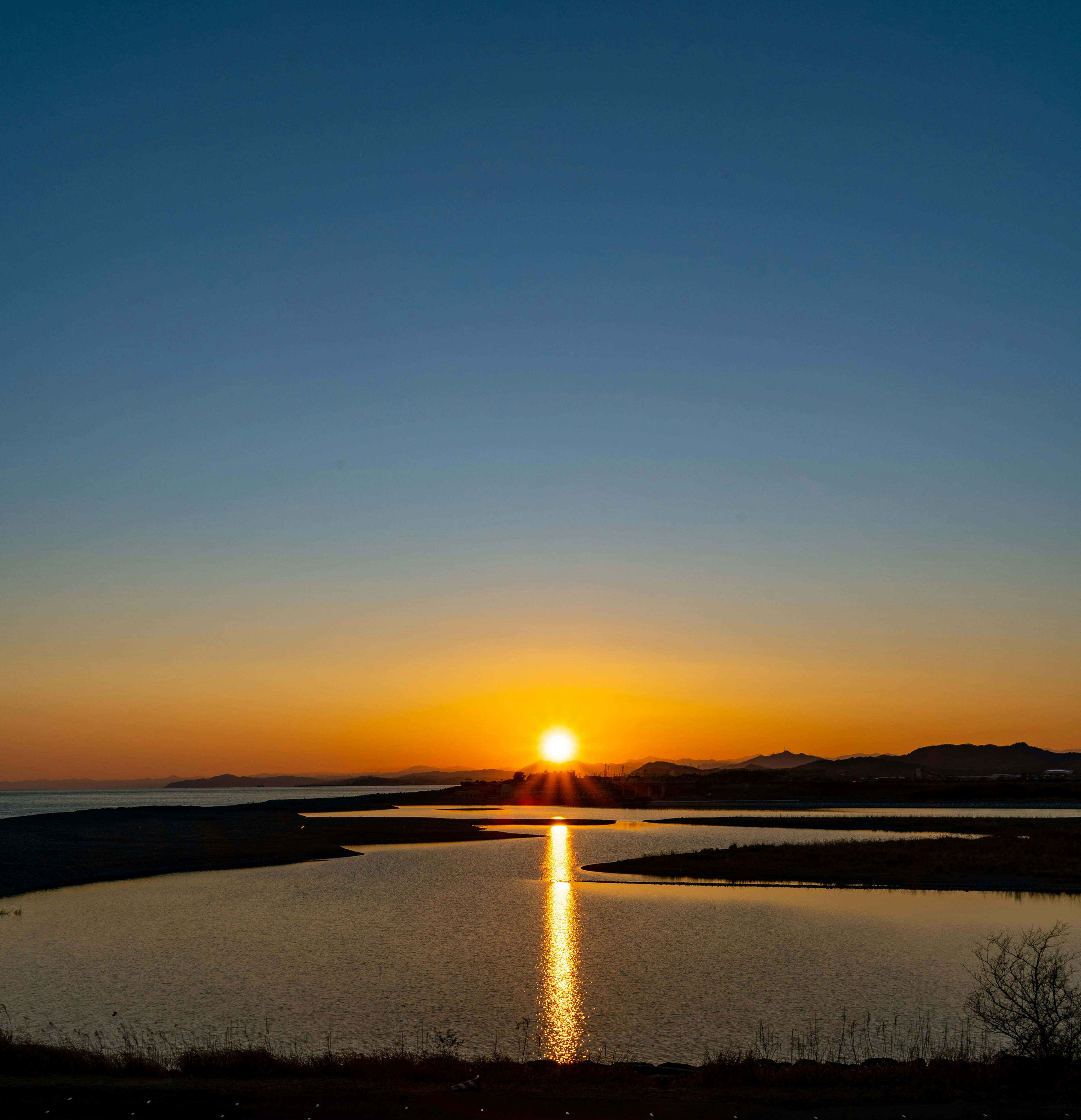 Stunning landscape with sunset reflecting on water