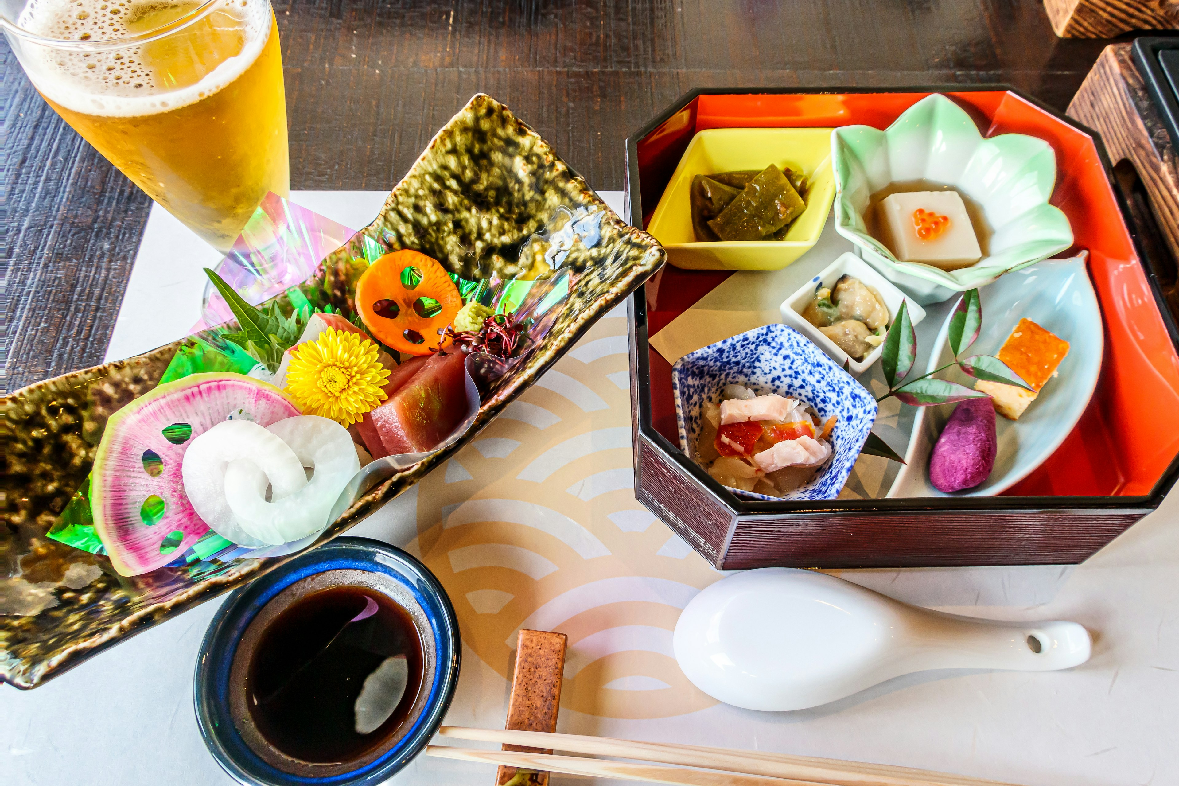 Colorful Japanese cuisine platter with beer