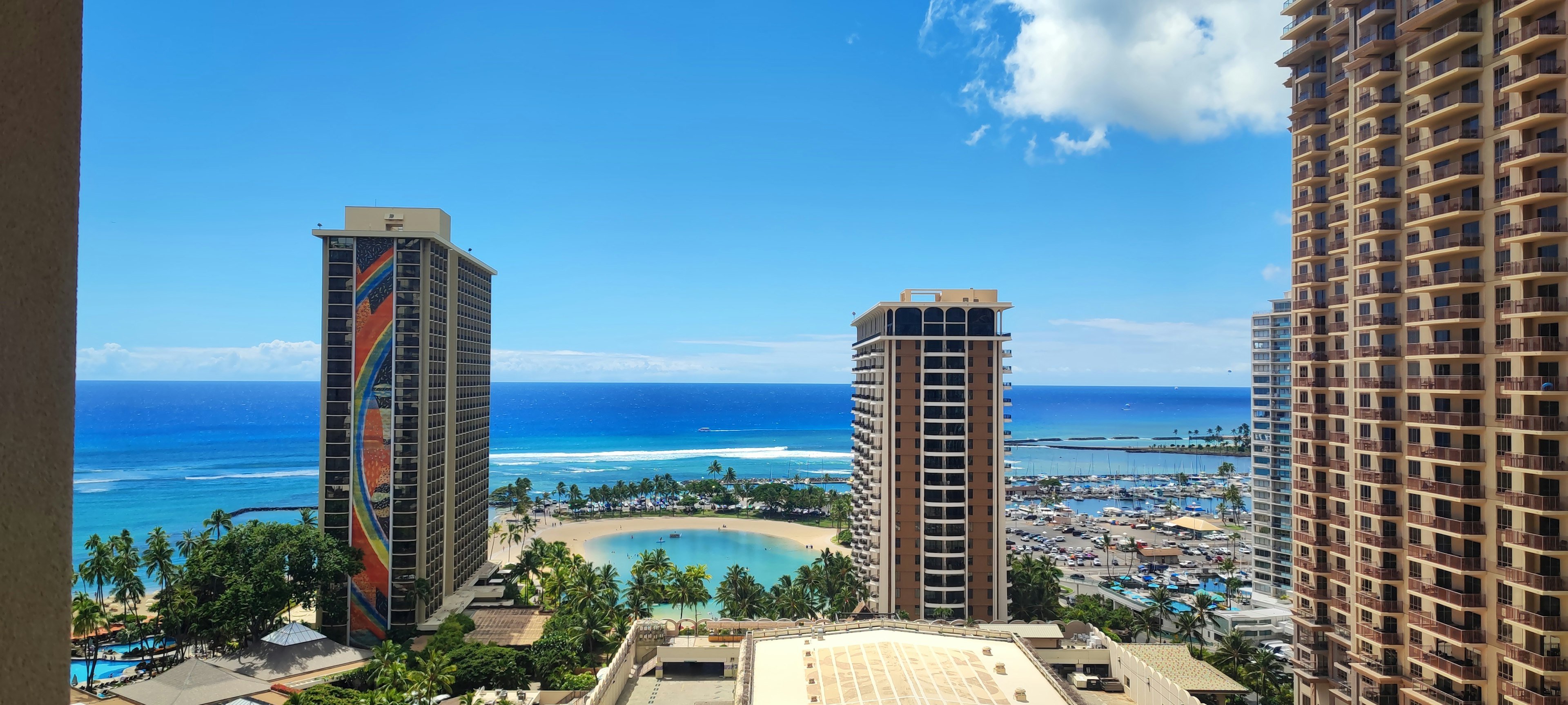 View of Honolulu with blue ocean and high-rise buildings