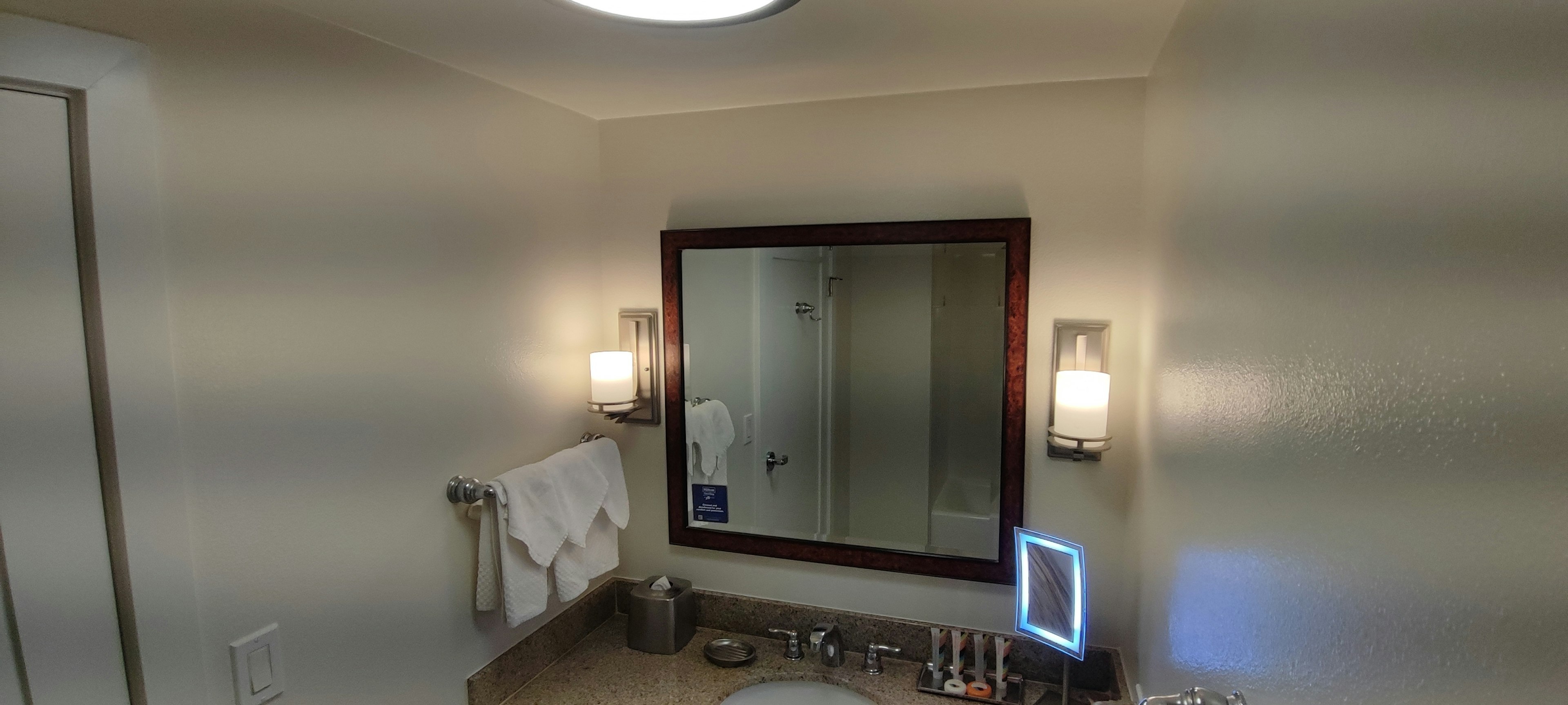 Interior of a bathroom featuring a mirror and sink