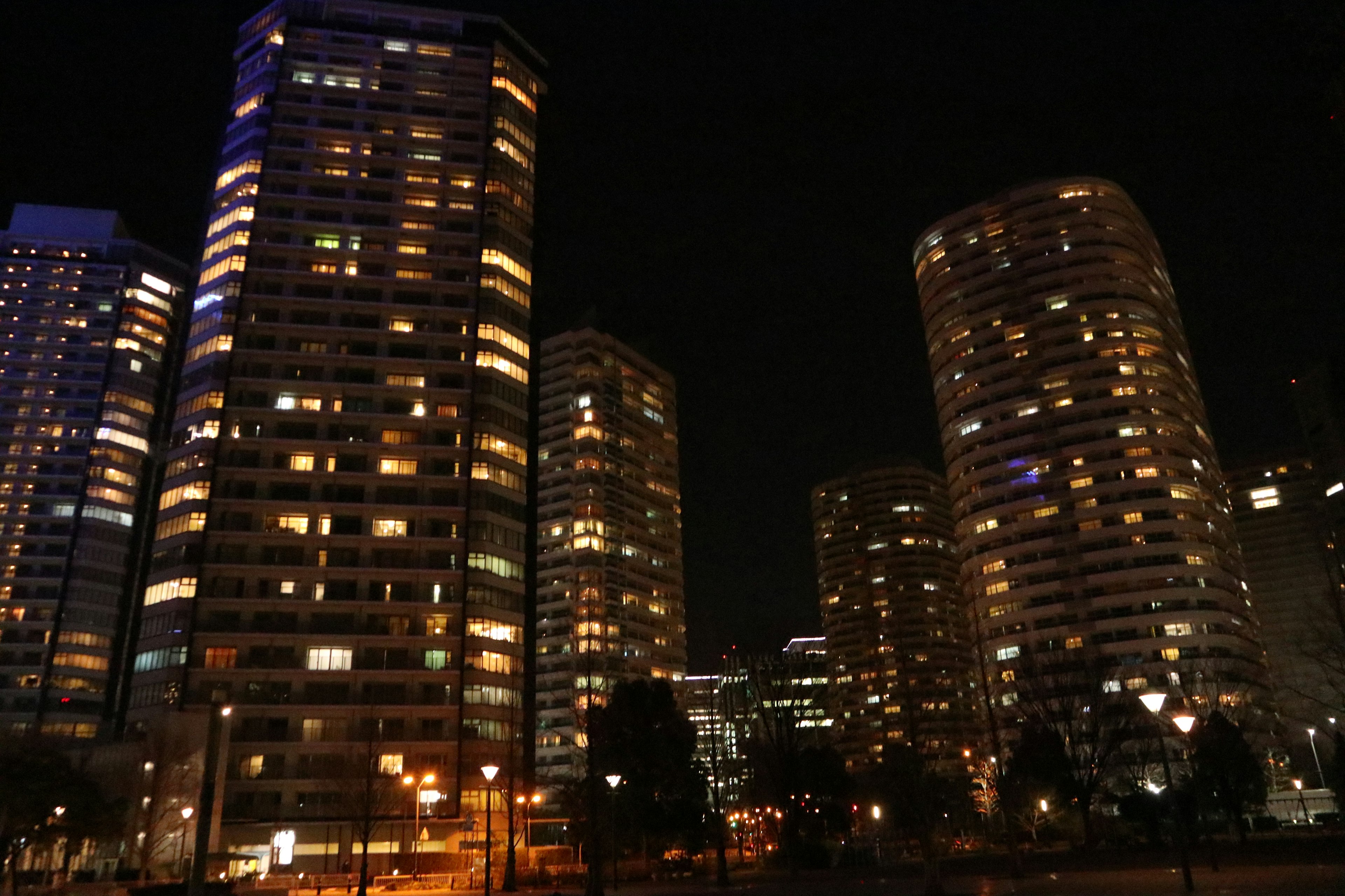 City skyline with illuminated skyscrapers at night