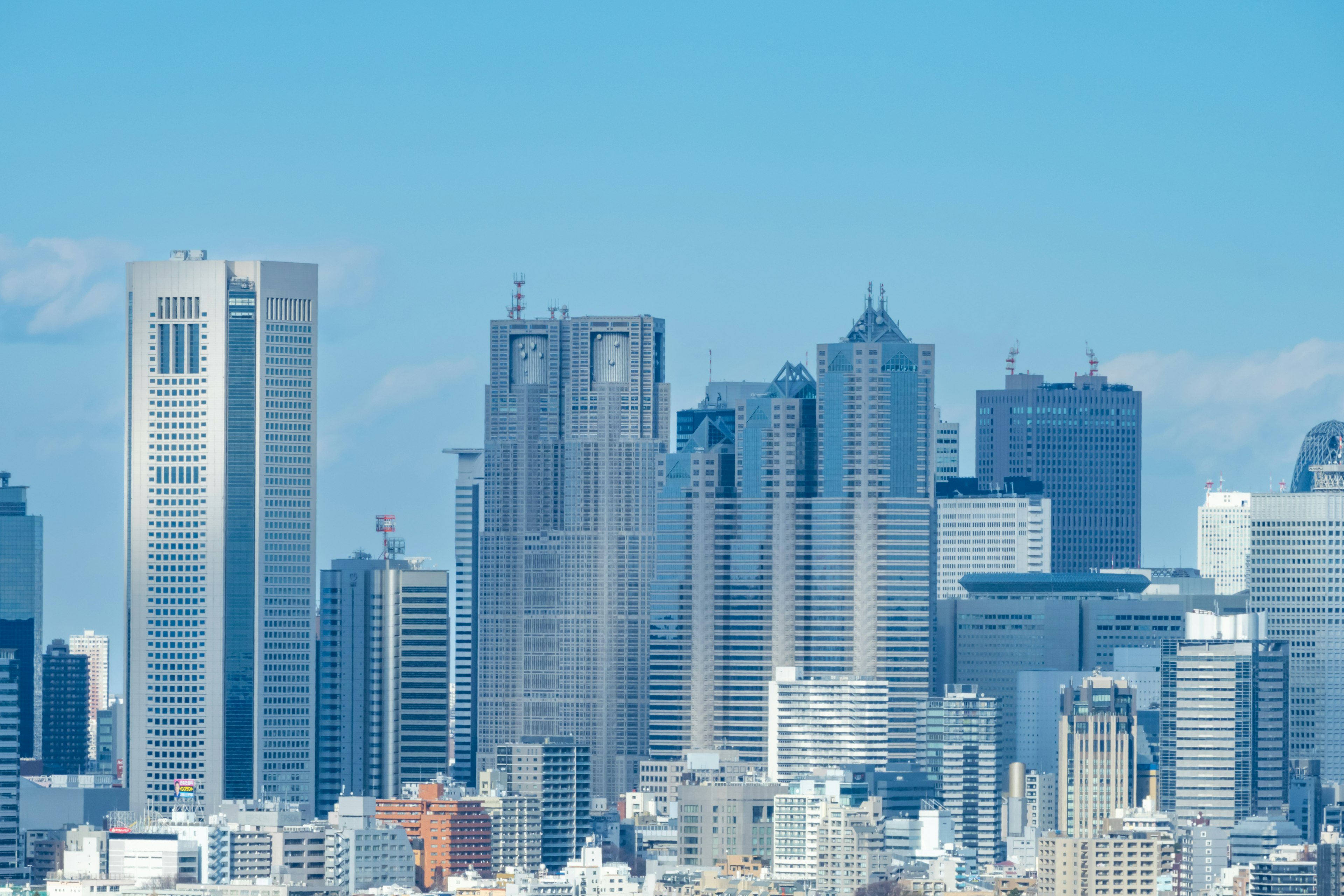 Tokyo skyline featuring modern skyscrapers and clear blue sky