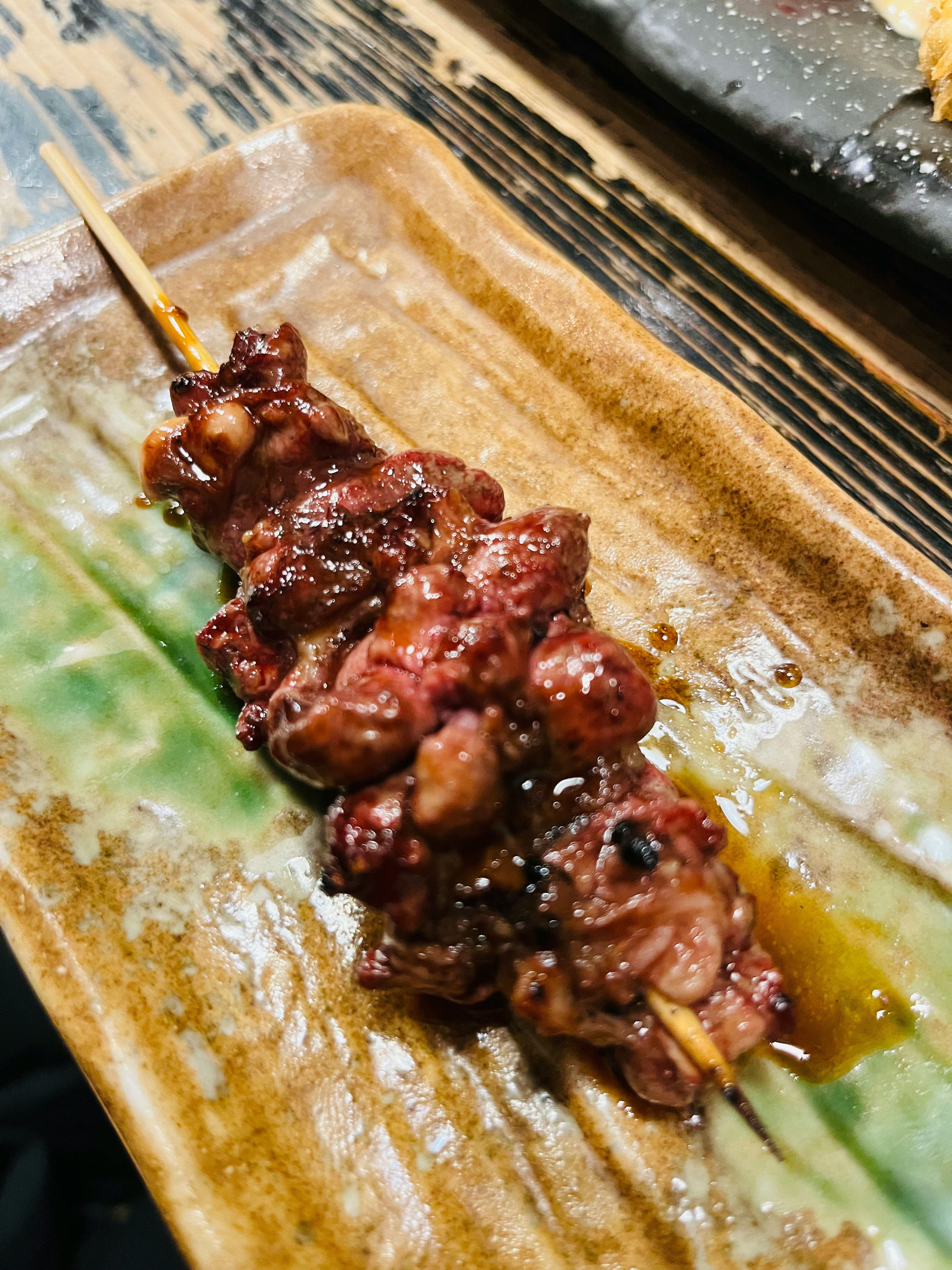 Skewered grilled meat served on a plate