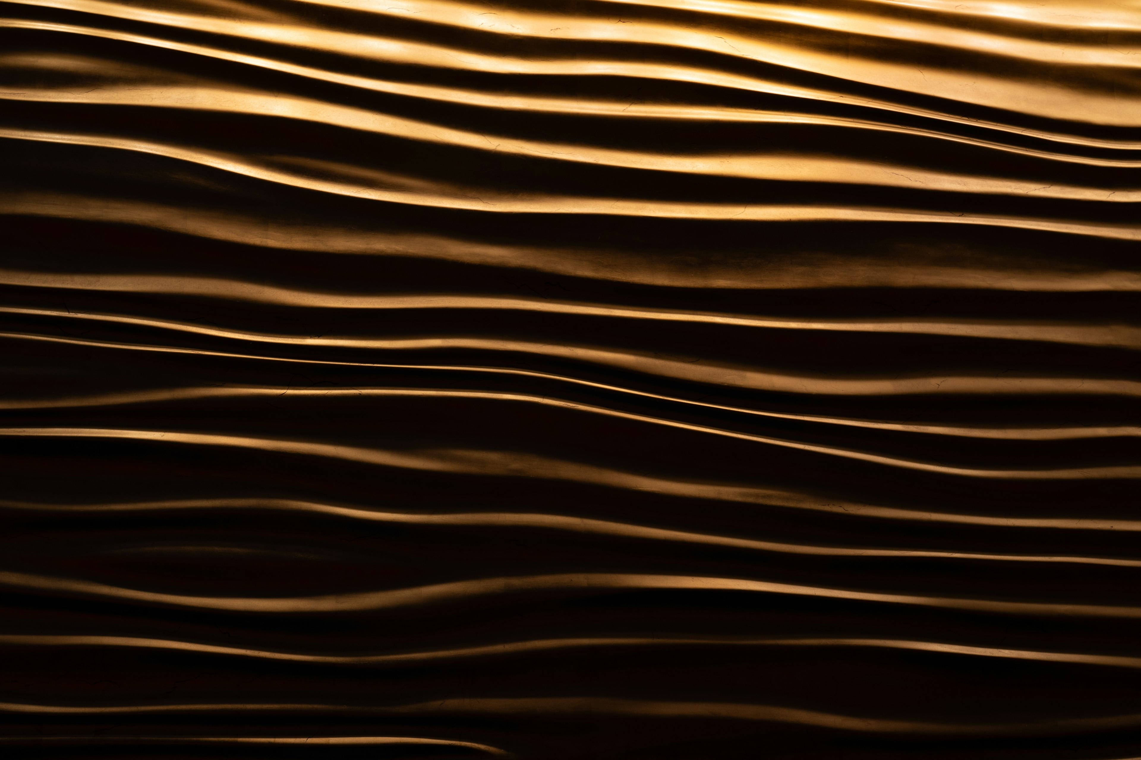 Smooth golden wave pattern texture