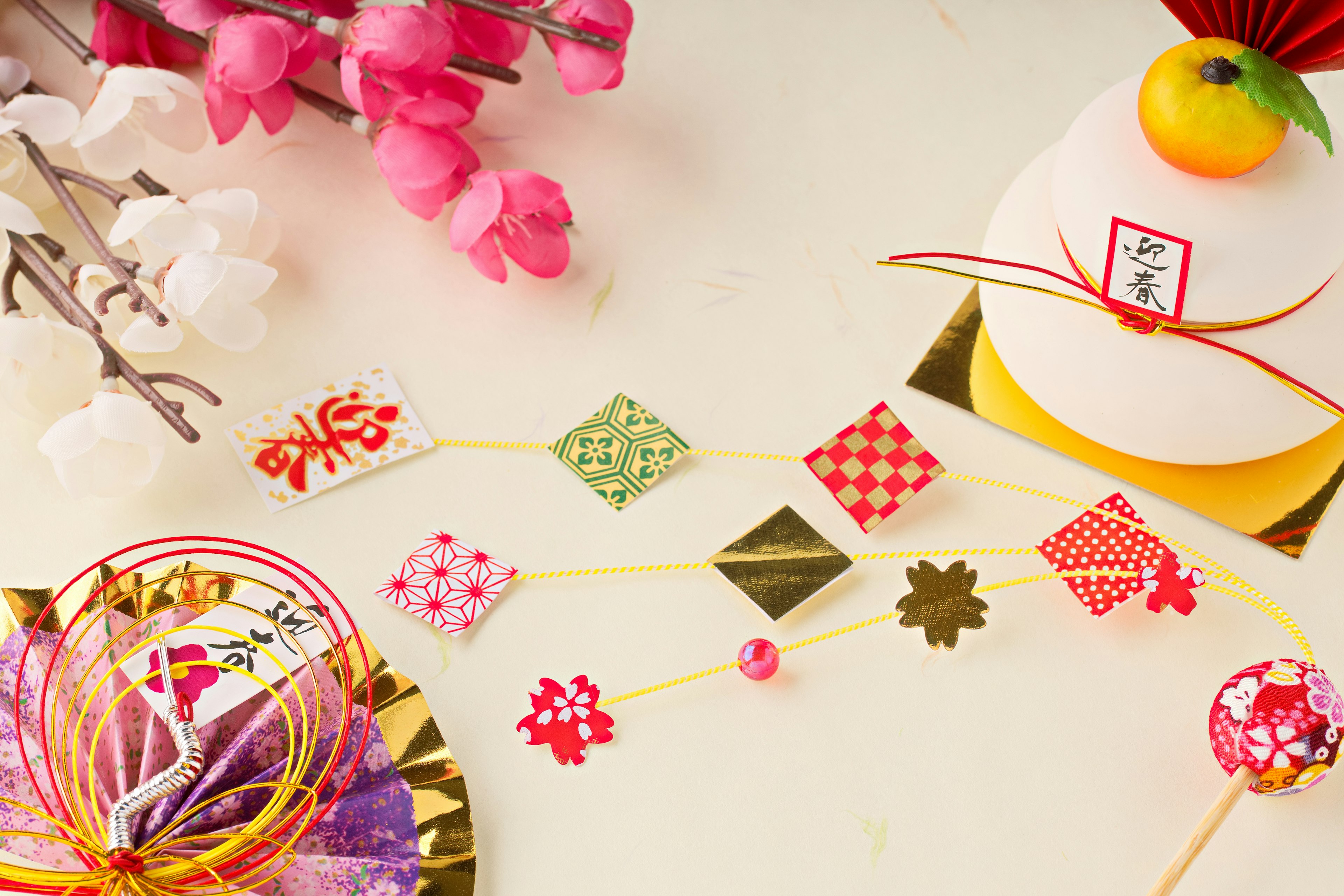 Colorful traditional Japanese decorations with origami and floral elements on a table