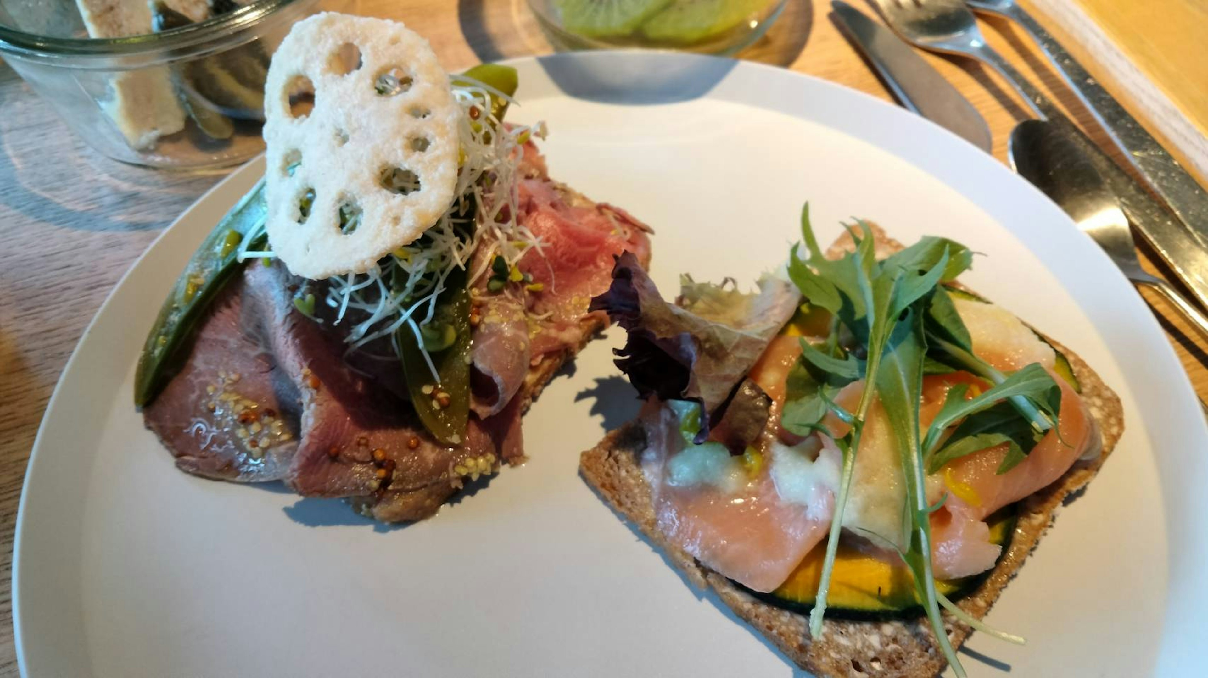 Two delicious open-faced sandwiches on a plate