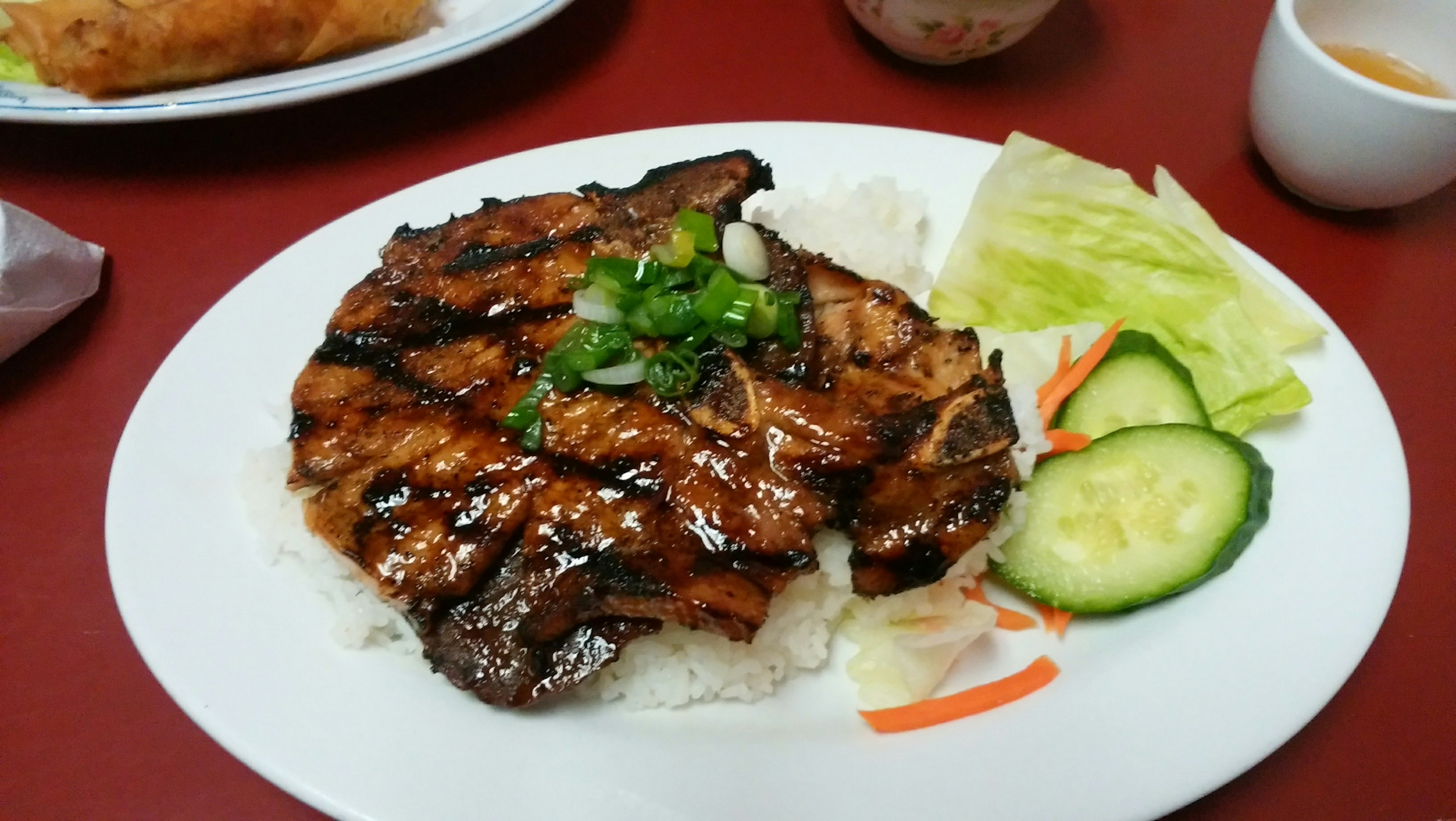 Grilled chicken glazed with a sweet and savory sauce served on white rice