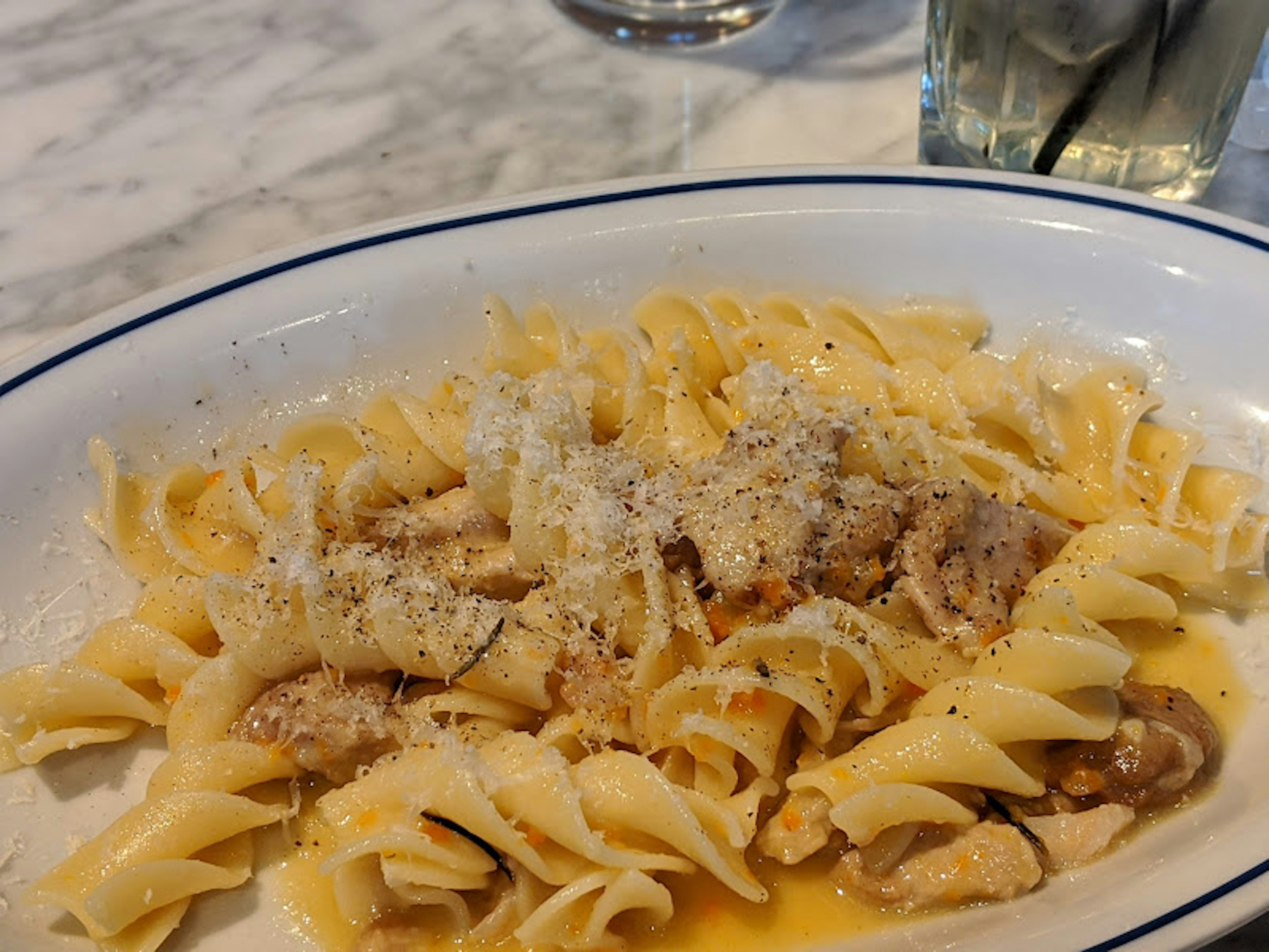 Creamy pasta dish topped with grated Parmesan cheese