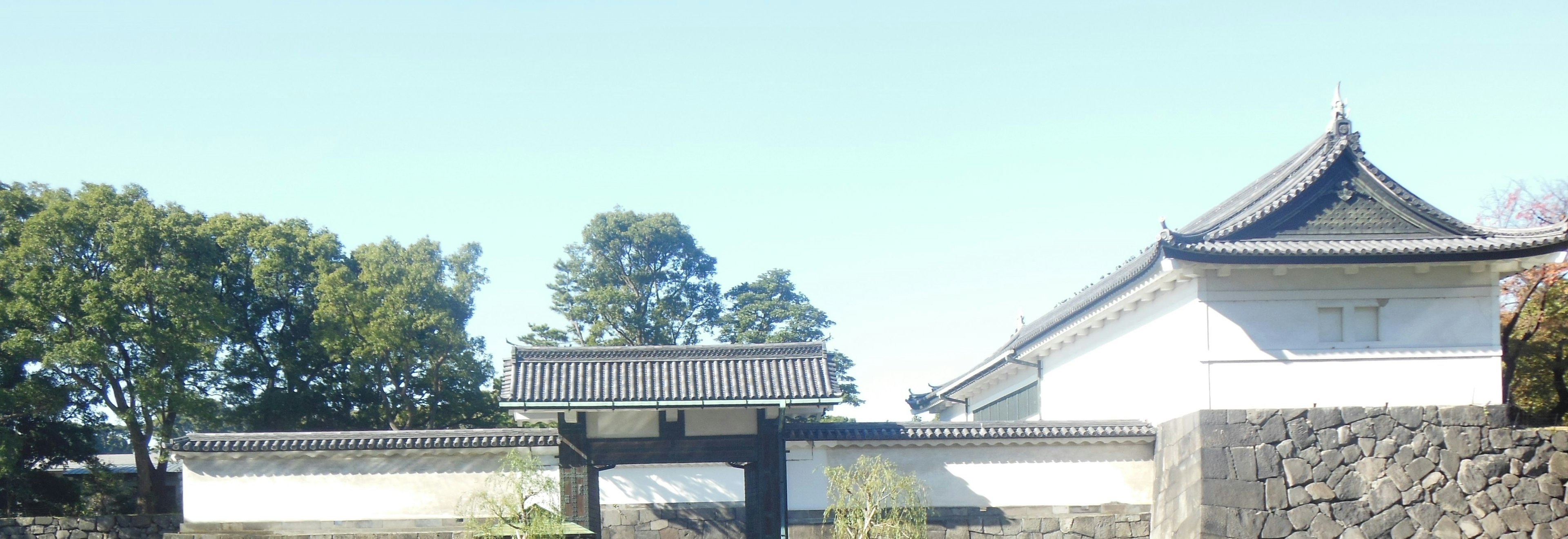 Traditional Japanese castle gate with white walls