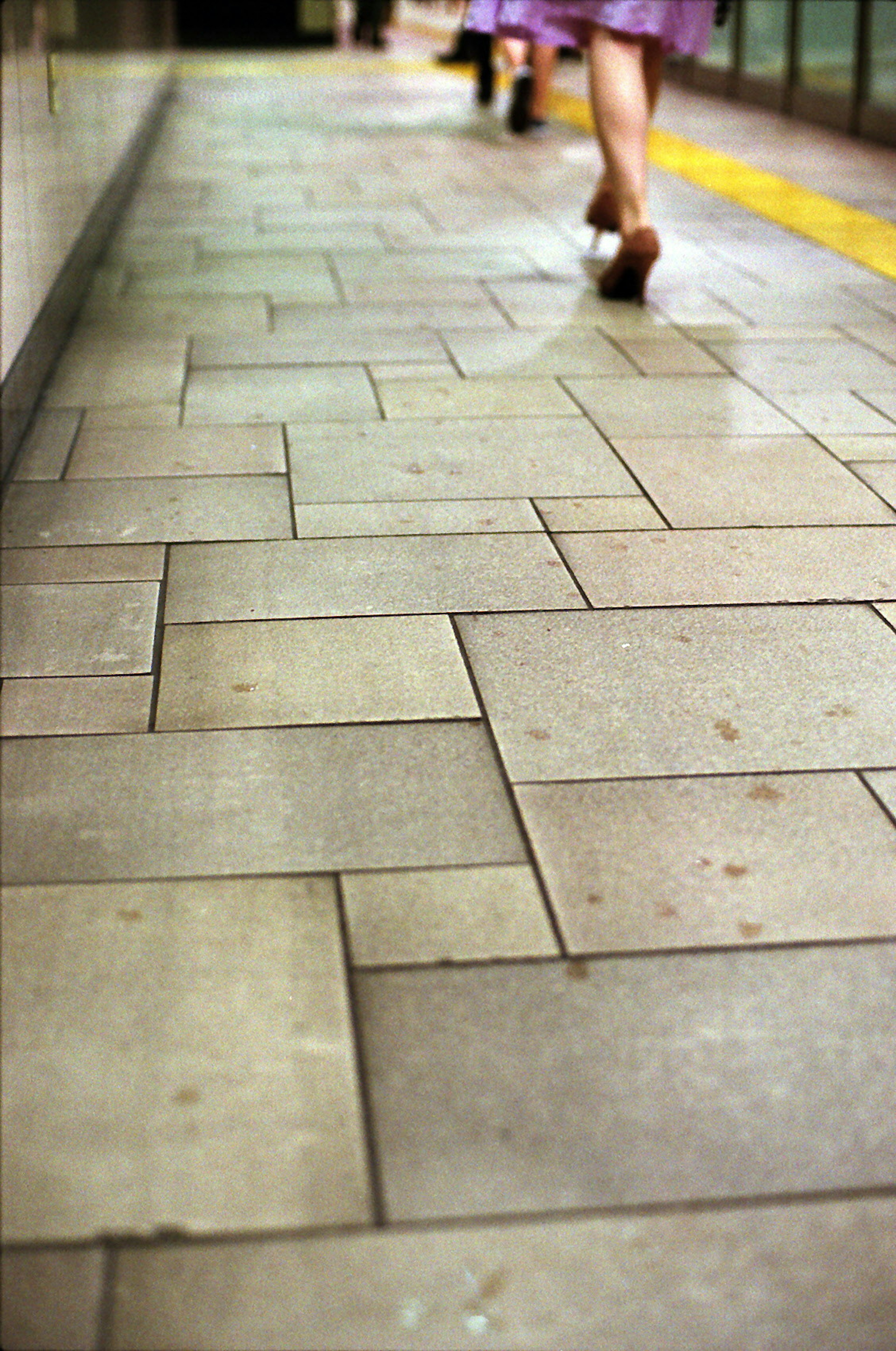 Paved walkway with a person walking