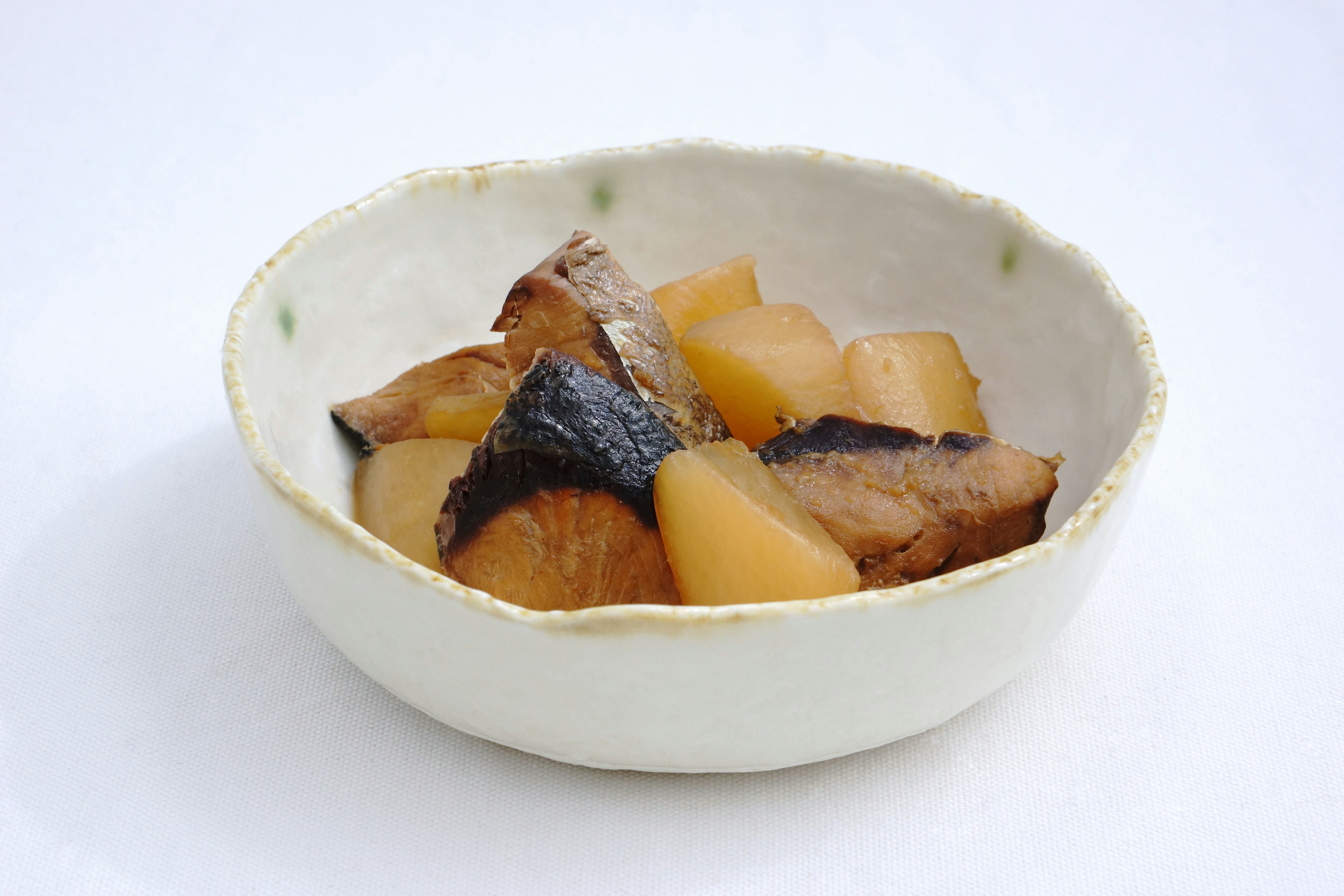 A bowl of simmered fish and daikon radish