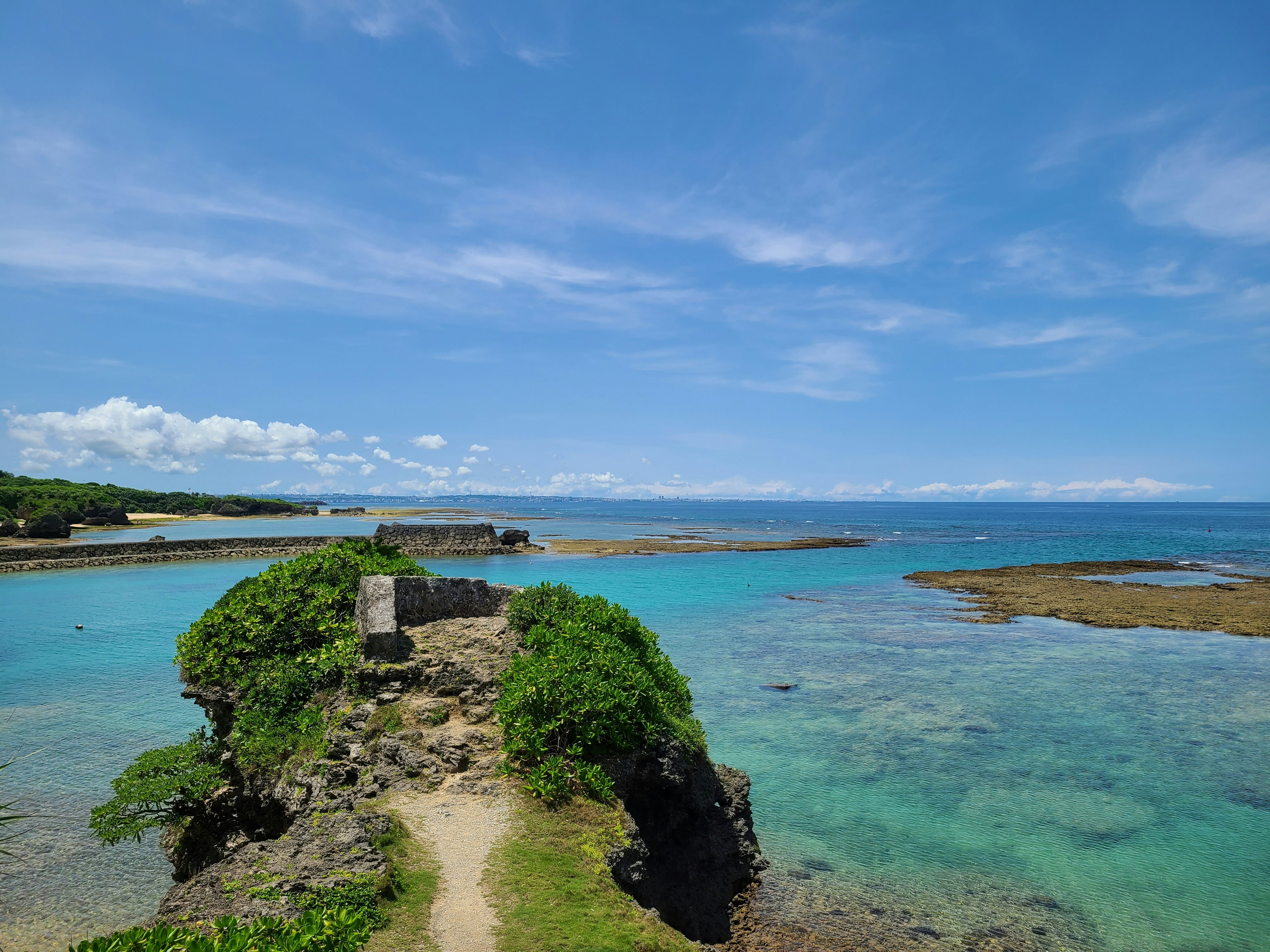 Natural landscape with blue sea and sky green vegetation on a small island