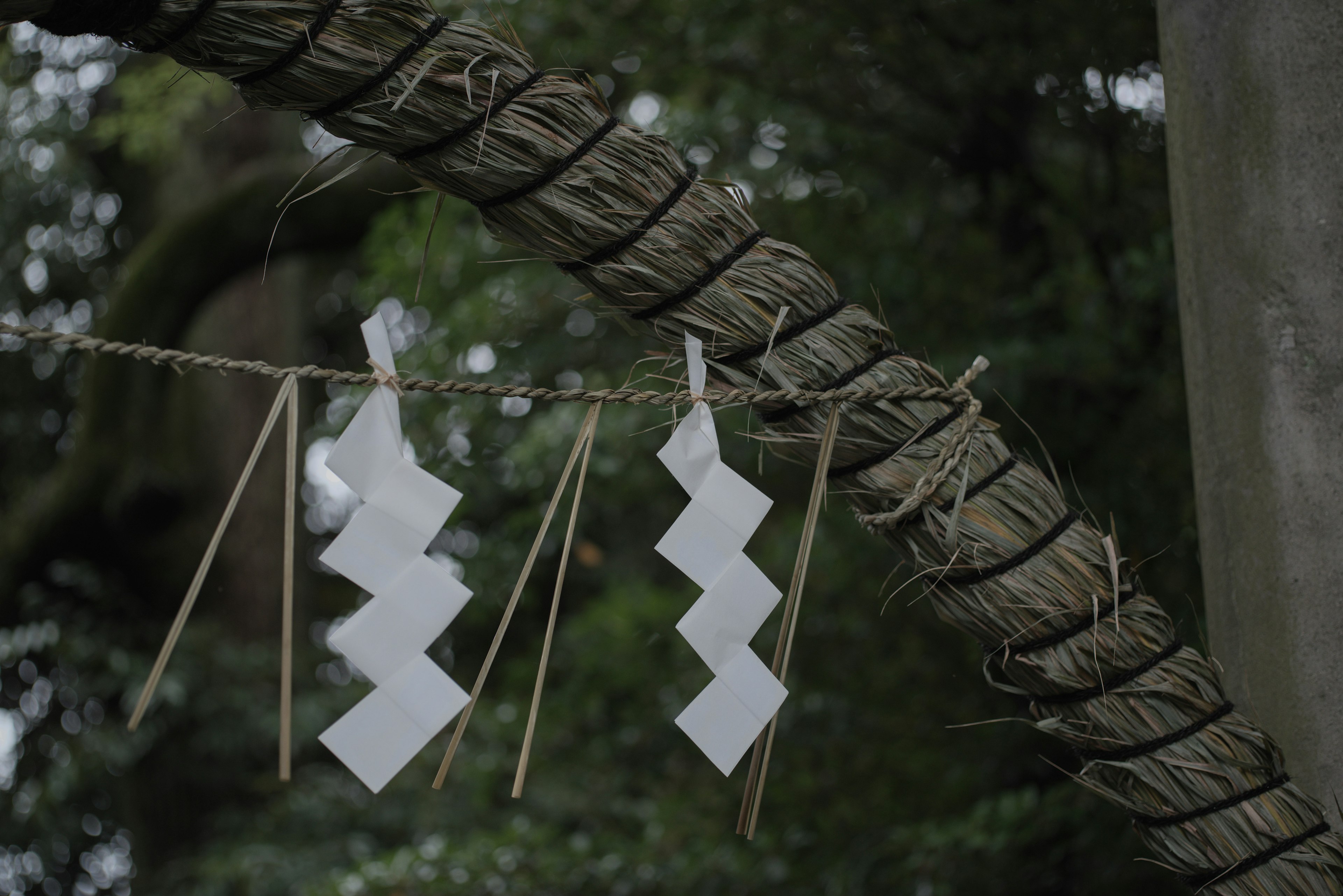 White zigzag decorations hanging from a rope