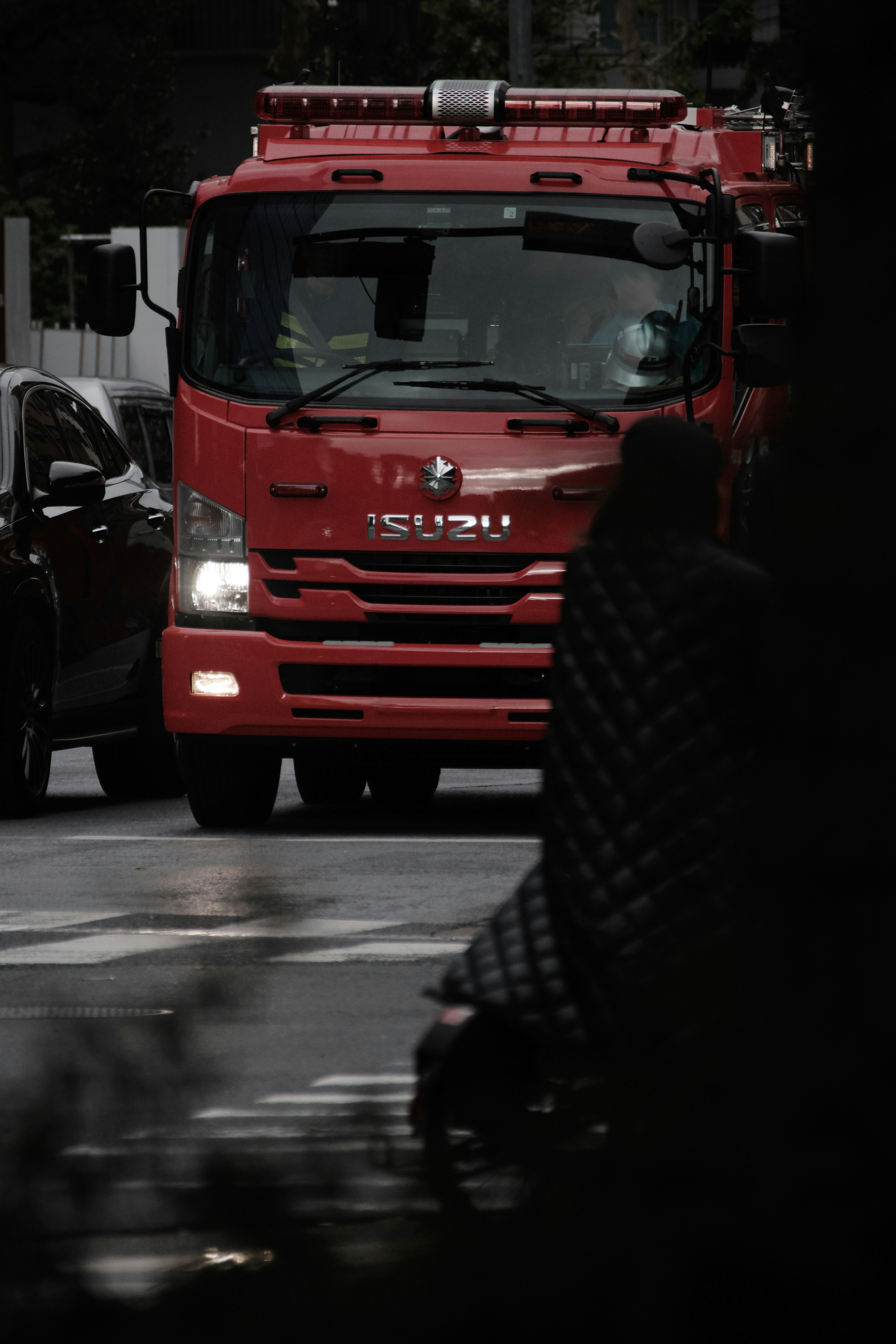 Red fire truck driving on the road